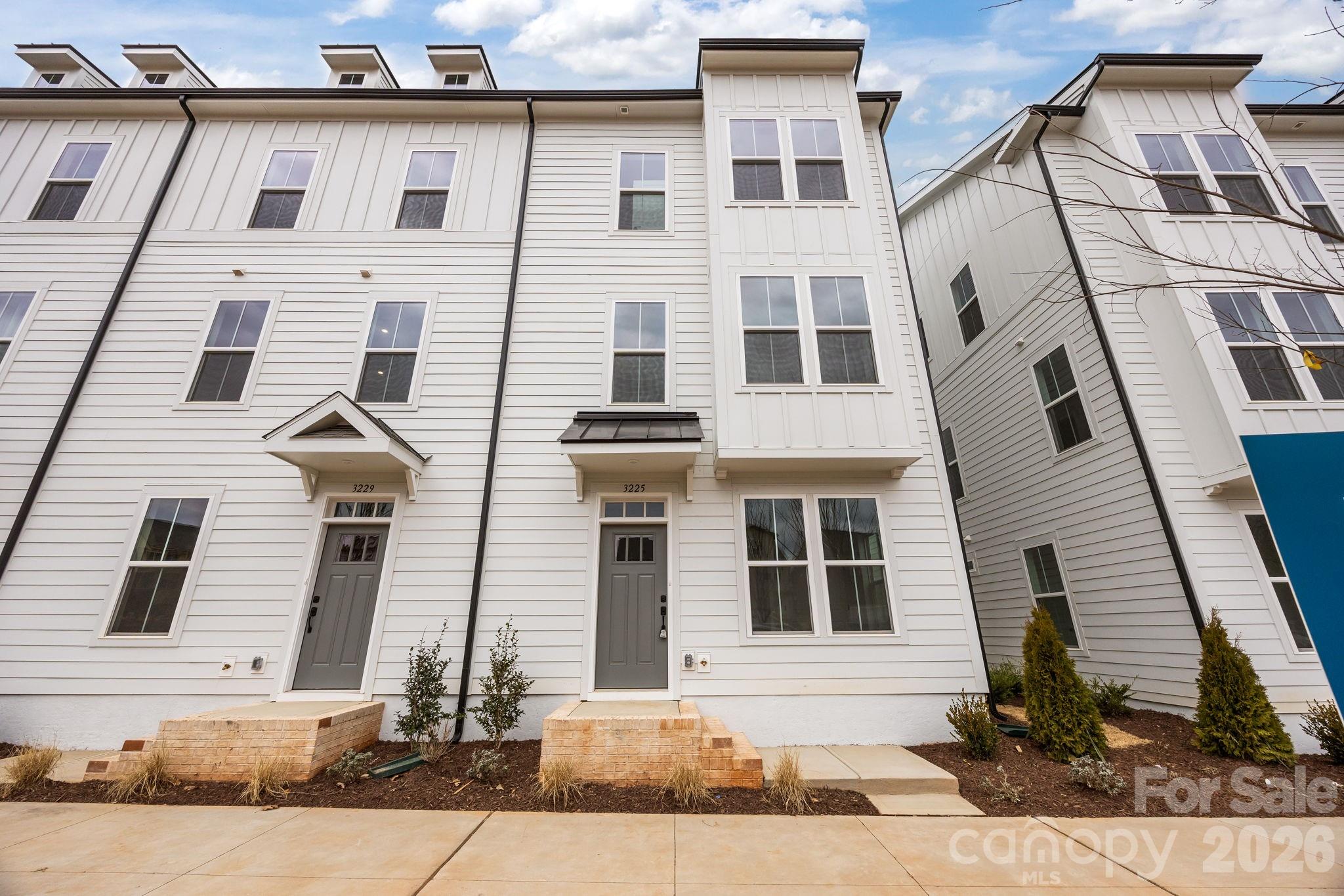 Welcome to The River District—a true master-planned community where lifestyle and location come together beautifully.

This beautifully appointed Landon three-story townhome offers a thoughtfully designed layout with a first-floor guest bedroom and full bath—perfect for visitors, multigenerational living, or a private home office.

The second level showcases a gourmet kitchen featuring quartz countertops, a built-in oven and microwave, electric cooktop, and soft-close cabinetry. The open-concept dining and living areas create an inviting space ideal for entertaining, while sliding glass doors lead to your private balcony—perfect for relaxing or enjoying your morning coffee.

Upstairs, you’ll find two beautiful owner’s retreats, each offering a bright, airy bedroom and a spa-inspired bath for ultimate comfort and privacy. A conveniently located laundry area completes the upper level.

This home is filled with beautifully curated interior finishes, individually hand-selected by our professional design team, creating a cohesive and elevated aesthetic throughout.

Location is everything—and at The River District, you’re truly minutes from it all. Planned community amenities include a resort-style pool, clubhouse with fitness center, tennis and pickleball courts, parks, scenic trails, a working two-acre farm with an on-site farmer, and a riverfront amphitheater.

Day on Market Reflect construction time.