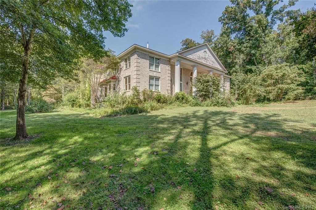 Remarkable, palatial home in need of work, but with a price that makes it a fantastic buy! The possibilities are endless: Indoor pool, upper bedrooms with space for private kitchens, spacious and private yard.
