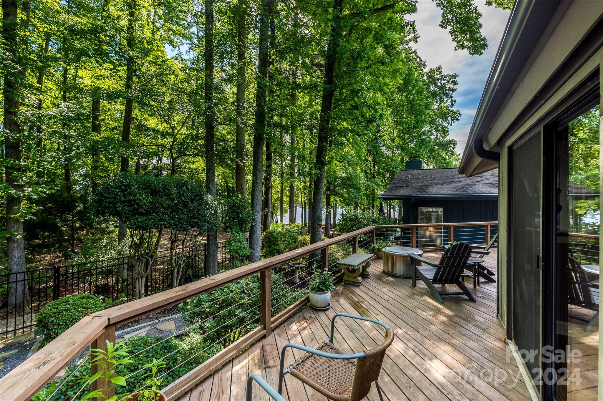 Welcome to your new waterview home in the hidden gem of River Hills!  Sit on the wrap around rear porch that overlooks Lake Wylie or take a walk down to the private community beach through your back gate.  Enjoy everything this amenity rich resort like community has to offer.  Easy living in this 3 bedroom ranch floorplan that also offers a 2+ car detached garage & huge sunroom & private office!  Filled with natural light, this home is move in ready.  Beautiful Asian Walnut hardwood flooring, lots of storage and walk in closet space.  2 bedrooms open right on to wrap around deck.  HVAC & ductwork, roof, flooring & light fixtures new in 2020.  Encapsulated crawl.  Come home to a resort everyday https://www.youtube.com/watch?v=GVw1ZBLxaXw.