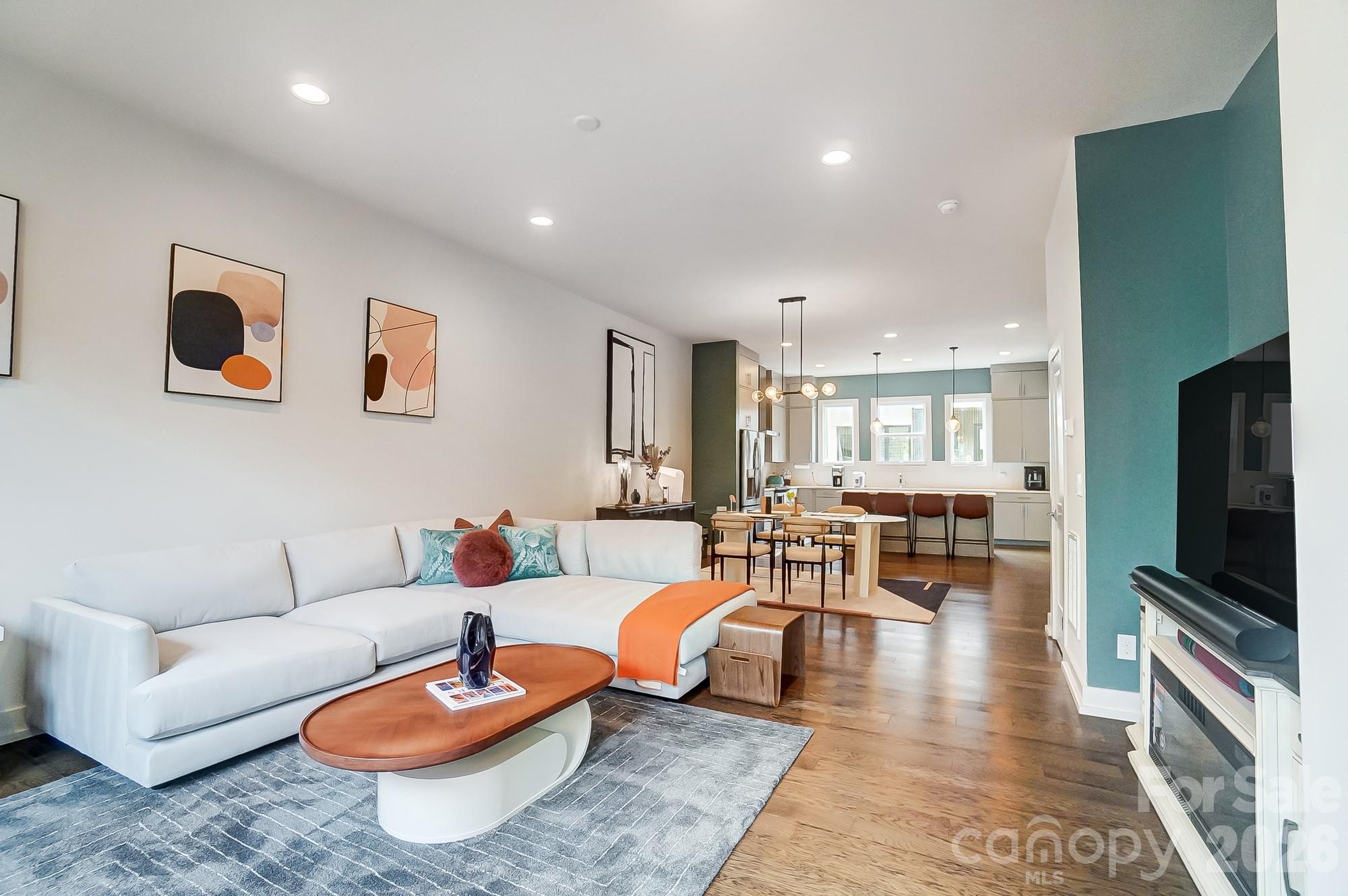 Gorgeous NoDa townhome in The Terraces at 36th Street, tucked into NoDa’s Arts District. Built in 2019 with true contemporary design, this 3-bedroom home plus dedicated office/flex space offers 3 full + 1 half baths and 2,575 sqft of bright, open living in the heart of NoDa. This home was pre-inspected and all recommended repairs were made. The seller renovated the top floor bathroom to convert it from a 1/2 to FULL bathroom, fully permitted!

Inside, enjoy 10’ ceilings, expansive windows, and an open-concept layout connecting the living and dining areas to a sleek chef’s kitchen featuring a massive island, induction cooktop, stainless steel appliances, and a walk-in pantry. Stunning wood floors, curated finishes, and a thoughtful floorplan make this home feel elevated and move-in ready.

The primary suite is a true retreat with a huge walk-in closet, dual vanities, and an oversized shower. Multiple work-from-home options on both the lower and upper levels offer flexibility for an office, gym, or guest space. The top-floor suite functions beautifully as a second primary or guest retreat and opens directly to the private terrace—perfect for entertaining, enjoying morning coffee, and taking in the neighborhood views.

Additional highlights include an attached 2-car garage and an unbeatable location—walk to dining, nightlife, boutique shopping, the light rail, and local favorites like Yoga Center, NoDa Bodega, and Artisan’s Palate, plus a nearby neighborhood park. Schedule your showing today!