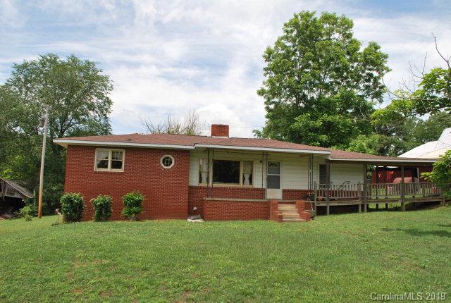 country farm close town.   3 bedroom, 1 bath brick home on 16+/- acres.  This property was for many years an actual working farm.  Most of the property is mostly level pasture along with a large older barn, detached metal carport along with a creek on the property.  The home has a new roof, original wood floors, oil heat along with a monitor heater, wood heater and central air.  The pool has not been used recently.  The property is convenient to I-40, McDowell Tech, Marion and more. Beautiful horse or cattle farm  just needs some TLC.