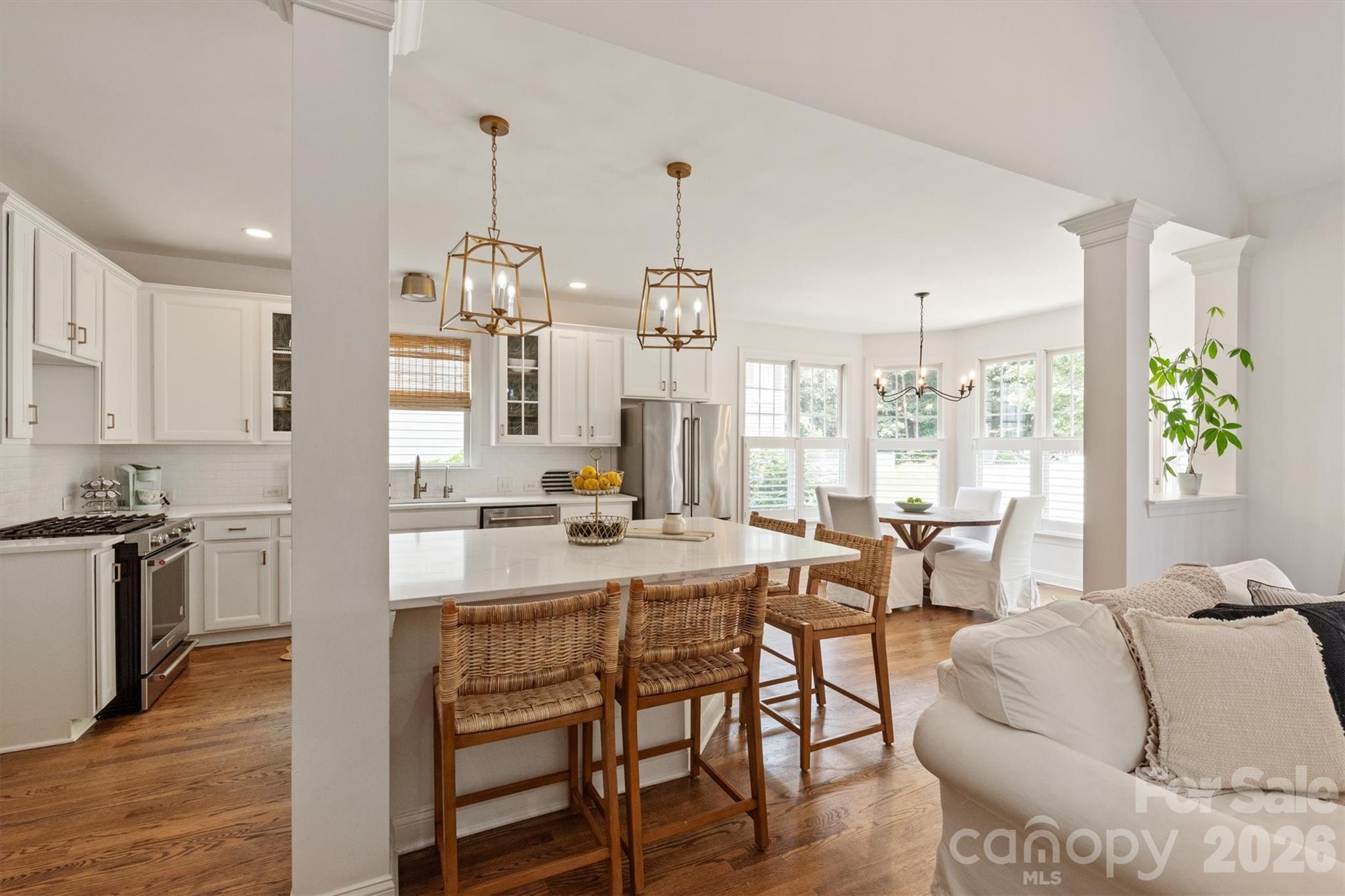 RENOVATED throughout with TIMELESS choices of Snowbound paint, white kitchen with quartz countertops, oversized island, gold hardware, and new lighting throughout. Bright open floor plan with a TWO STORY family room anchoring the main living space with rich HARDWOOD FLOORS throughout the ENTIRE home adding warmth and sophistication. MAIN FLOOR owner's suite with COMPLETELY RENOVATED spa-inspired bath featuring an oversized shower, dual vanities, gold hardware, and natural wood accents. Formal dining, FIFTH bedroom, and fourth FULL bath on the main floor. Second floor with large bonus room, three secondary bedrooms with WALK-IN closets, and two additional FULL baths. Whole house WATER FILTRATION SYSTEM with REVERSE OSMOSIS and recently painted interior/exterior. Across from a pocket park and the Baxter walking trail system, and situated on a private, .33 acre wooded lot! Walkable to the Baxter Village pool, clubhouse, tennis courts, shopping/dining on Market Street, and Music in the Park. Preferred lender is offering a temporary BUY DOWN rate! Baxter Village is not just a community, it is a lifestyle like no other in the Charlotte area!