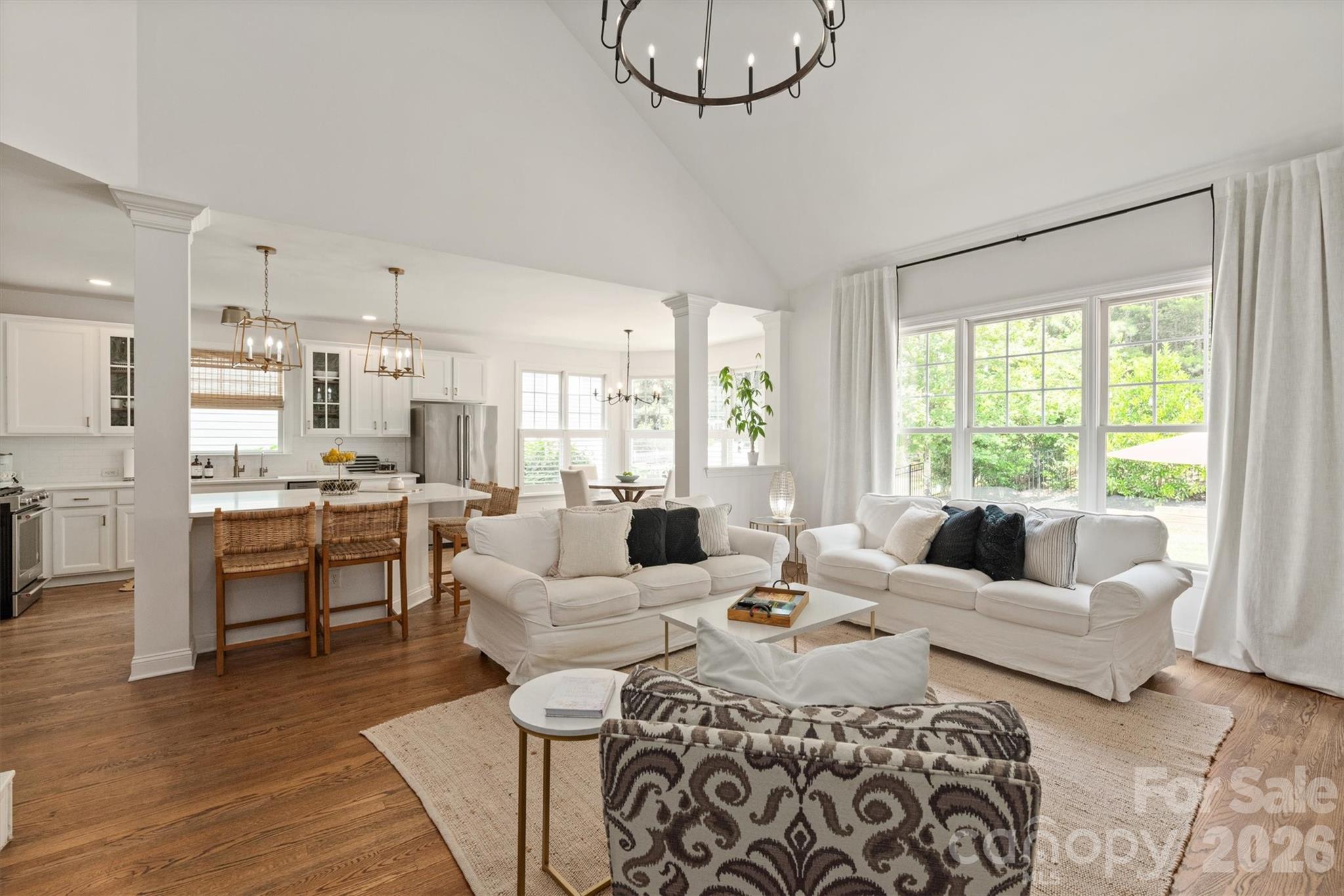RENOVATED throughout with TIMELESS choices of Snowbound paint, white kitchen with quartz countertops, oversized island, gold hardware, and new lighting throughout. Bright open floor plan with a TWO STORY family room anchoring the main living space with rich HARDWOOD FLOORS throughout the ENTIRE home adding warmth and sophistication. MAIN FLOOR owner's suite with COMPLETELY RENOVATED spa-inspired bath featuring an oversized shower, dual vanities, gold hardware, and natural wood accents. Formal dining, FIFTH bedroom, and fourth FULL bath on the main floor. Second floor with large bonus room, three secondary bedrooms with WALK-IN closets, and two additional FULL baths. Whole house WATER FILTRATION SYSTEM with REVERSE OSMOSIS and recently painted interior/exterior. Across from a pocket park and the Baxter walking trail system, and situated on a private, .33 acre wooded lot! Walkable to the Baxter Village pool, clubhouse, tennis courts, shopping/dining on Market Street, and Music in the Park. Preferred lender is offering a temporary BUY DOWN rate! Baxter Village is not just a community, it is a lifestyle like no other in the Charlotte area!