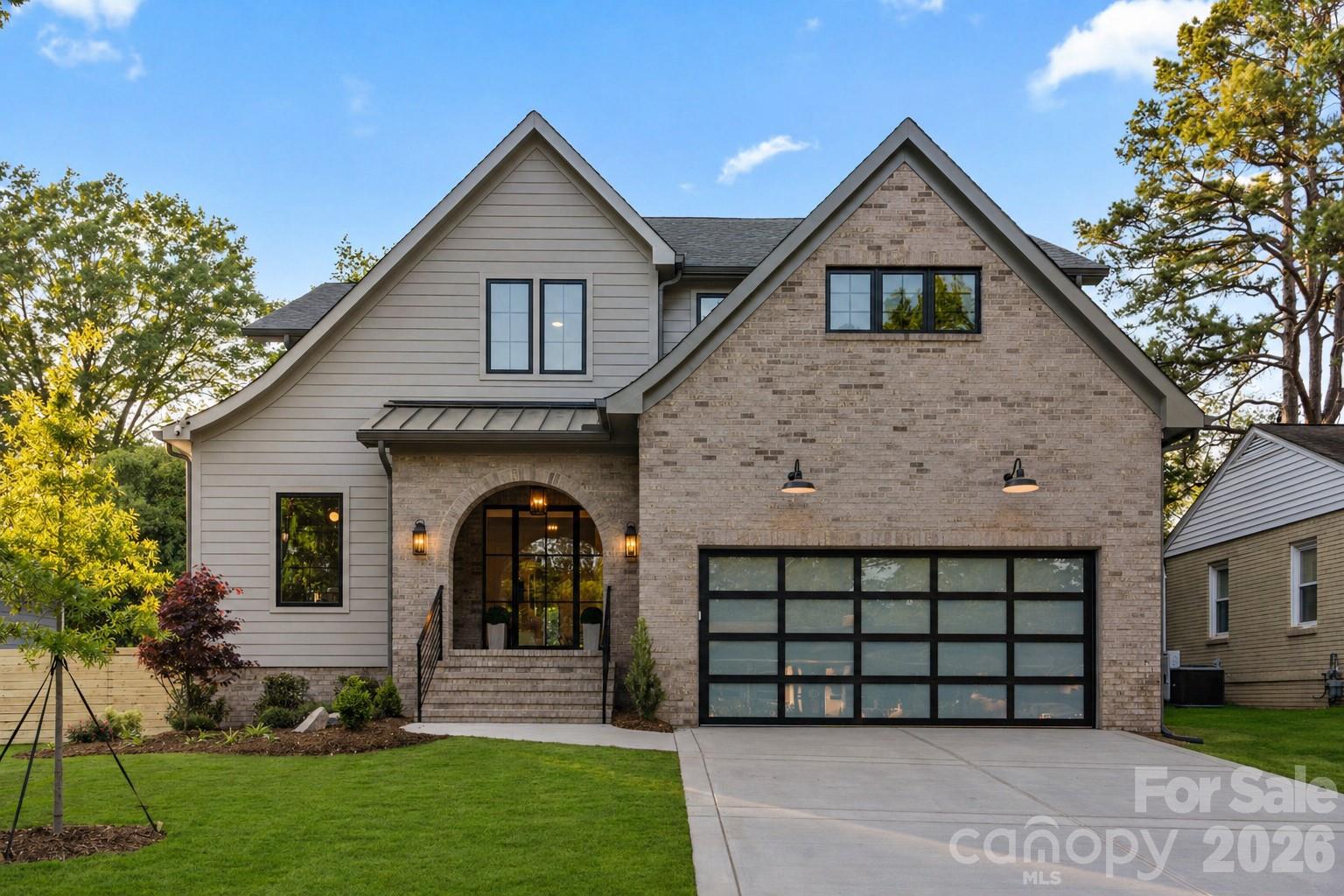 Exceptional new construction home that doesn’t just check the box…it sets the standard! Step inside to wide-plank wood flooring, soaring vaulted ceilings, and natural light that fills the home from every angle, creating a warm yet refined atmosphere. The main living areas flow effortlessly, designed for both elevated entertaining and comfortable everyday living. The center of connection is this amazing light-filled kitchen and dining area. Featuring an oversized island, 6-burner gas range with griddle, built-in refrigerator, and a fully equipped scullery with beverage drawers that keeps everything organized behind the scenes. The primary suite on the main level is a true retreat, highlighted by vaulted ceilings, expansive windows, a spa-inspired bath that feels like a private escape, extra large walk-in closet with laundry hookup. Upstairs, four spacious ensuite bedrooms and a large bonus room provide flexibility for any lifestyle whether it’s hosting guests, creating a media space, or carving out a quiet workspace. Many details and features, including the a dedicated hosting station with ice maker, and beverage refrigerator, drop-zone with custom locker system, laundry on both levels, walk-in pantry off of the scullery, and a secondary office or studio space off of the second level ensuite.  This home seamlessly blends indoor and outdoor living, the covered back porch and outdoor kitchen are built for year-round enjoyment,  All overlooking a flat, fully usable backyard, ideal for entertaining, play, or future expansion.  This is more than a home is a statement of design, function, and elevated living. All of this located in the friendly Sedgefield neighborhood, just seconds from South End and minutes from Uptown!