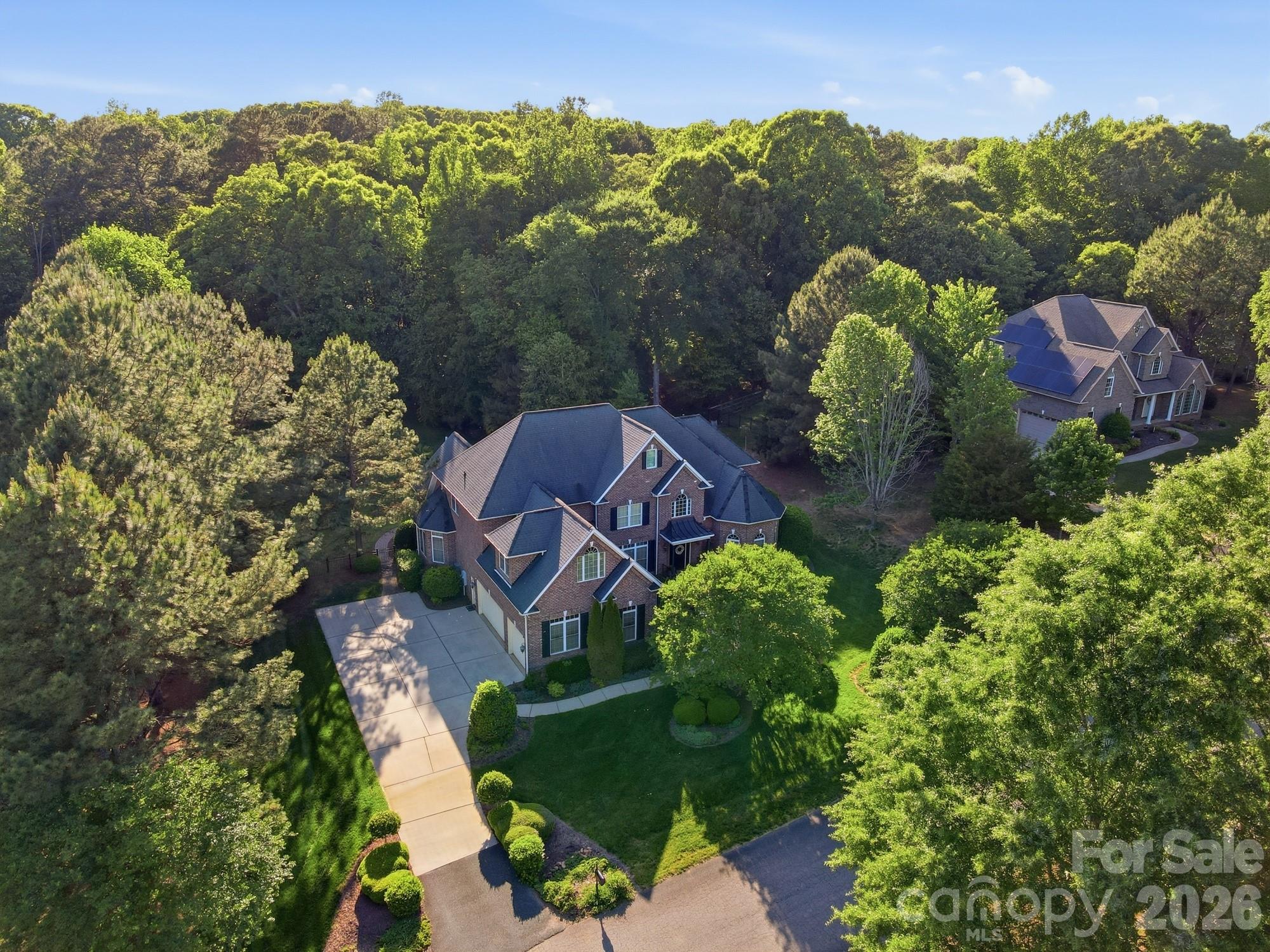 Backyard oasis with pool awaits you on this large private lot!
Welcome home to this custom, full-brick beauty located in Huntington Farms. While the home is meticulously cared for and features a fantastic floor plan, it serves as a pristine canvas ready for a cosmetic refresh. The foundation for a dream home is already here: a soaring two-story family room anchored by dramatic floor-to-ceiling windows, a main-level primary retreat, and a generous sized home office tucked behind elegant French doors. The open-concept kitchen and sitting  room provide the perfect setting for entertaining, with abundant space for gatherings. The kitchen is equipped with a large prep island, granite countertops, and stainless steel appliances, plus a walk in pantry. Upstairs, you’ll find three generously sized bedrooms—one with an ensuite bath, while the other two share a split Jack-and-Jill bathroom. A large bonus room with a built-in bar spans over the garage, offering excellent recreation space. Don't miss the storage on the third floor, which is already drywalled, with separate HVAC system and an egress window, providing great potential for additional living space with the addition of flooring.
Step outside to your private outdoor oasis, complete with a beautiful pool and spa, expansive patio, and built-in fire pit—perfect for relaxing or entertaining year-round!
Located in the highly sought-after Fort Mill School District with convenient access to Indian Land, Rock Hill, and Charlotte, this is truly a home you don’t want to miss!