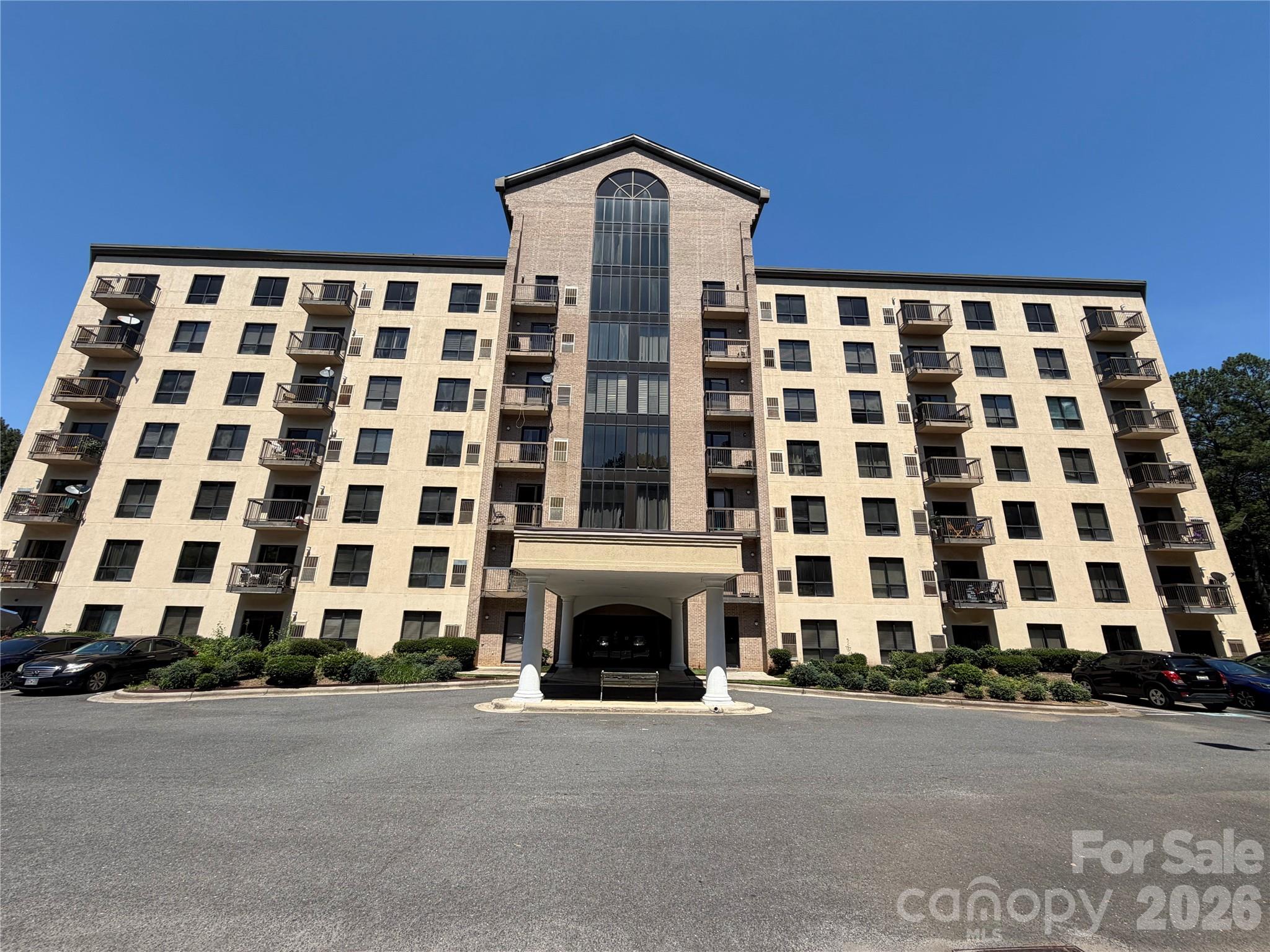 Welcome home to this bright and beautifully maintained 2-bedroom, 2-bath corner unit in the highly sought-after Fort Mill School District. The corner location provides abundant natural light, enhancing the LVP flooring throughout and the open, inviting feel of the home. The kitchen shines with granite countertops, crisp white cabinetry, and stainless steel appliances, perfect for everyday living. The spacious primary suite features an en suite bath with double sinks, ample storage, and a walk-in shower, offering a private retreat. A split-bedroom floor plan ensures added privacy, with a generously sized guest bedroom and full bath that conveniently includes a stackable washer and dryer. Ideally located just minutes from the state line, this home offers an easy commute into Charlotte while enjoying the benefits of Fort Mill living. Comfort, convenience, and location come together in this move-in-ready condo.