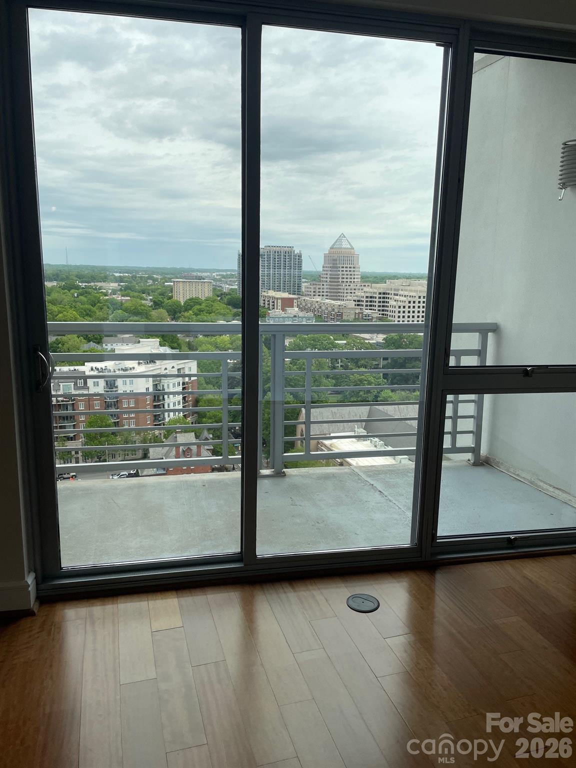 Welcome home to this spacious 2-bedroom, 2-bath condo in the heart of Uptown Charlotte. Featuring a bright, open-concept floor plan, this residence offers an expansive L-shaped living and dining area framed by a dramatic wall of windows showcasing impressive city views and abundant natural light.

The modern kitchen is equipped with stainless steel appliances, granite countertops, and a large island that opens seamlessly to the main living space—perfect for entertaining or everyday living. The generous primary suite includes a large walk-in closet and private bath, while the secondary bedroom provides flexibility for guests, a home office, or roommate living.

Additional conveniences include an in-unit washer and dryer, secure building access, secured garage parking with one assigned space, and ample nearby street parking. Residents enjoy access to desirable community amenities, including a pool, fitness center and rooftop terrace.