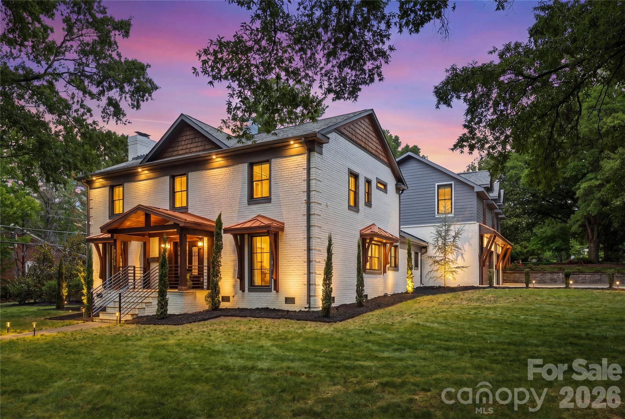 An outstanding opportunity to own a truly remarkable Myers Park Residence in one of Charlotte's most sought after locations. This Stunning Residence was completely renovated in 2022 with Exceptional Craftsmanship, Luxurious finishes, and the Sophisticated Artistic Design. This Home meets the High-Standards of Large families with a Primary-Suite on the Main floor, Secondary suite on second floor, and a Grand Secondary Living Quarters above the large heated & cooled garage!

As you enter the home you are greeted with an Artistic Overlay from custom accent walls, detailed ceilings, exotic stone, and a striking Hickory waterfall staircase. From the Grand Wrought-Iron Double-Door entry to the resort-style backyard, every detail has been thoughtfully curated to impress. 

The Chef's Kitchen is complimented with high-end finishes including Monogram Appliances. en gas range with custom hood, farmhouse sink, built-in refrigerator, abundant custom cabinetry, and an oversized island designed for gathering and entertaining. Rare Quartz runs along the kitchen countertops and backsplash giving it a sophisticated design. Flowing seamlessly into the dining area and family room, the artistic-concept is enhanced by designer lighting and finishes. The Large Wood Beams and Sky-Lights compliment the high-ceilings in the Great Room. The luxurious Primary Suite provides a cozy setting with a custom fireplace and beautiful wood beam ceilings. The Master-Bathroom provides a spa-inspired retreat with dual vanities, separate his-and-hers showers, custom lighting, custom Garden Tub, and an expansive walk-in closet. Marble and designer tile appointments elevate every bathroom, complemented by high-tech anti-fog LED mirrors. Multiple guest suites provide exceptional comfort and privacy, including a private suite above the garage. Three additional upstairs bedrooms feature generous custom closets and are complemented by a dedicated study nook and homework space. 

The newly constructed three-car garage includes its own HVAC system, sink, EV charger, and access to an extra-wide driveway with parking for four additional vehicles. Above the garage, you have a secluded office, bonus room, gym, and additional full bath creating the perfect work-from-home and wellness retreat away from the main living areas!

The Resort Style fenced in backyard offers a Massive Covered Patio, two fireplaces, a terrace, and rare trees and shrubbery thoughtfully placed throughout.The backyard is designed for entertaining, complete with a built-in outdoor kitchen, grill station, and an expansive covered patio with ceiling fans and ambient lighting. 
This exceptional property seamlessly blends luxury, functionality, and privacy in one of Charlotte’s most sought-after neighborhoods. Convenient access to premier dining, shopping, entertainment, and highly regarded schools!