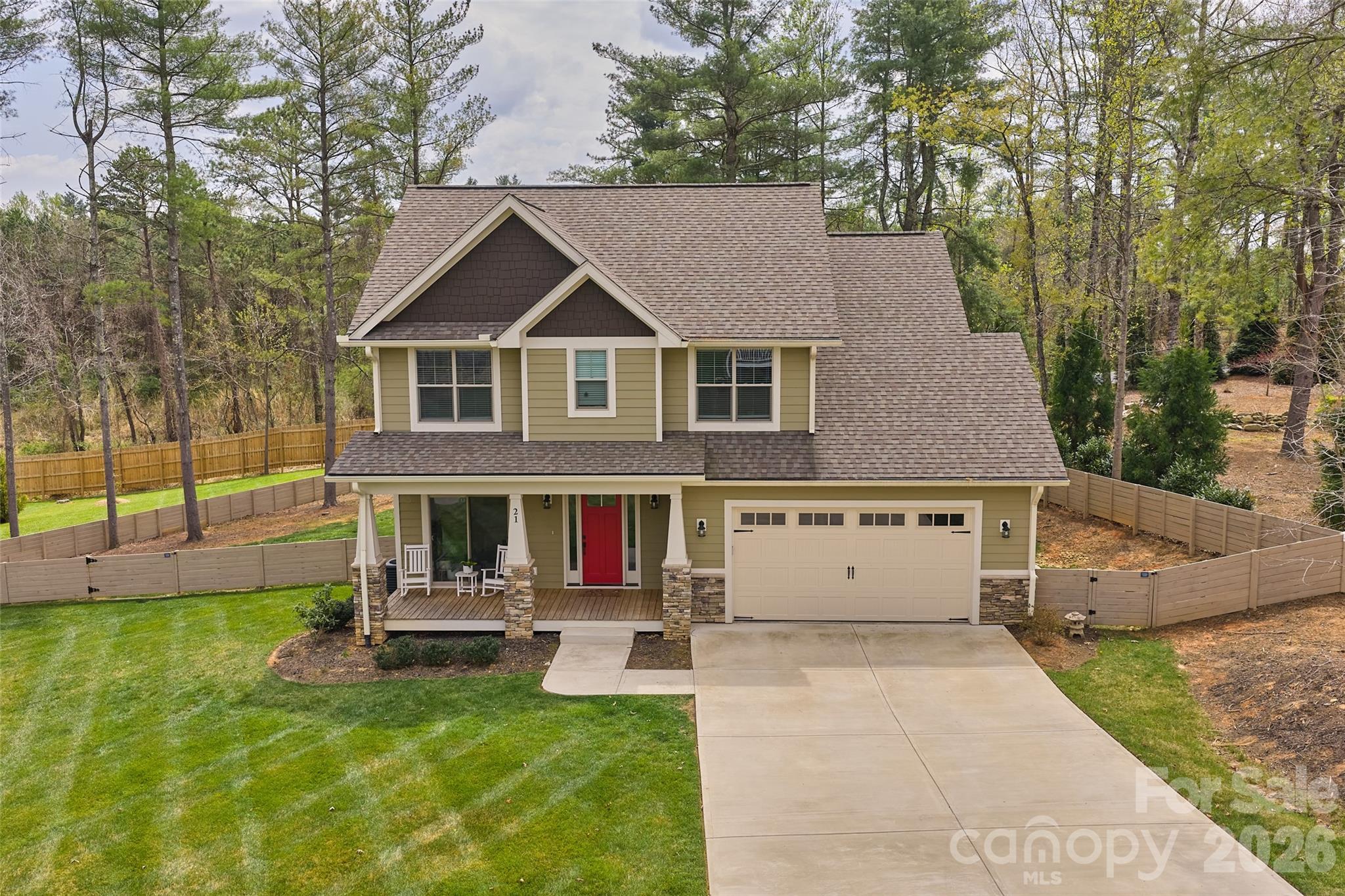First time on the market, this impeccably crafted 4BR/3.5BA South Asheville residence offers refined living with elevated finishes throughout. Built by a respected local builder, every detail reflects exceptional quality, comfort, and thoughtful design.

An classic elegant foyer opens to a light-filled, open-concept layout featuring high ceilings, a dedicated office, and a sophisticated living room with massive, stacked-stone fireplace. The well-appointed kitchen showcases a striking granite island with breakfast bar, ample workspace, and a walk-in pantry—flowing seamlessly for both everyday living and entertaining. Rich oak hardwood flooring and tasteful tile selections enhance the home’s timeless appeal.

The main-level primary suite is a serene retreat, complete with a spa-inspired ensuite bath and generous walk-in closet. Covered and open decks with tongue-and-groove ceilings extend the living space outdoors, overlooking a rare, fully fenced yard of over half an acre, a beautifully landscaped, natural backdrop—perfectly balancing privacy with a welcoming community feel.

Tucked on a quiet cul-de-sac within an intimate enclave, this home offers peaceful suburban living just 20 minutes to downtown Asheville and only 10 minutes to Biltmore Park, shopping, dining, movies, and the Asheville airport.

A rare offering where craftsmanship, location, and lifestyle align.
