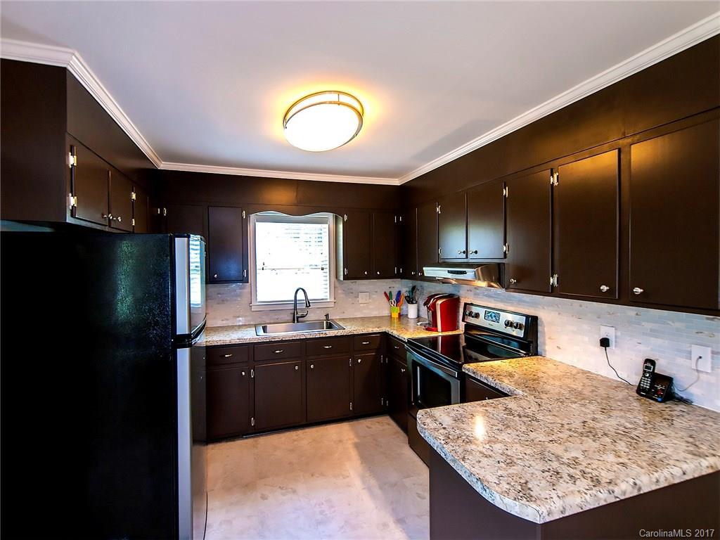 Corner lot on Mount Gallant. 3 bedroom 1.5 bath cozy home with a big fenced-in backyard. Master has the half bath in it. This home has a newly upgraded kitchen, new carpet, paint, bathroom vanities, new 2017 AC/gas pack and more! Home feels bigger than 1018 square feet. The laundry room/pantry is unheated square footage. Storage in the backyard 12'x16' custom built shed with 2 storage lofts. Close to Lake Wylie and Ebenezer Park. NOTE this property is 3 parcel numbers. New roof in Aug. 2012