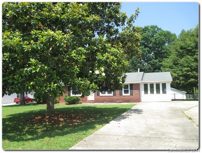 Fantastic mostly brick Ranch home w/ porch, covered deck, fenced yard & a large outbuilding/workshop located at the SW outskirts of Lancaster, SC. Well maintained interior, 3 good size bedrooms share 1 full bath. Large kitchen/breakfast with a woodstove (see pic). Large unheated sunroom on the Right side of the home as well as large heated living room makes plenty of room for entertainment. Private fenced backyard w/ benches & stone fire-pit shaded by a mature large tree at the back of the yard.