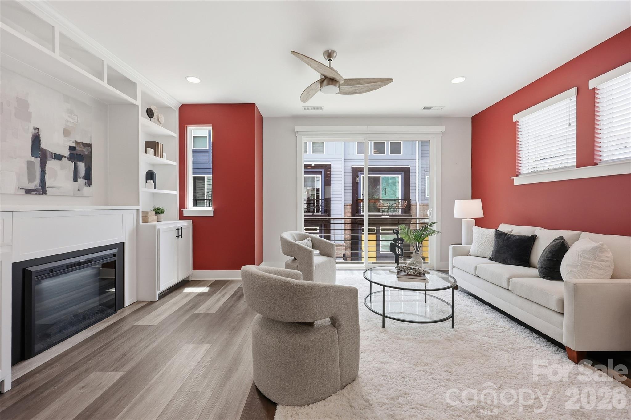 Incredible move-in ready, single-owner, END-UNIT townhome within walking distance to everything NoDa has to offer! Enjoy super easy parking with your first-floor, two-car tandem attached garage.

The main floor features a bright, open kitchen equipped with a generous island, updated lighting, and plenty of cabinet space. It flows seamlessly into a great dining area and a spacious living room. The sellers installed custom built-ins with an electric fireplace for extra storage, plus automated shades make it effortless to adjust for privacy or natural light. A convenient half bath finishes off this main living level.

Up on the third floor, a smart split-bedroom layout gives everyone plenty of privacy. The primary suite features a double vanity and a sizeable glass-door shower, while the guest bedroom includes a walk-in closet and its own full hallway bath with a tub.

Working from home is a breeze thanks to the top-floor loft that is perfect for a quiet office complete with its own private powder room. When it's time to clock out, step onto the expansive ROOFTOP TERRACE to unwind and take in the neighborhood views.

HOA fee covers landscaping, water, sewer, trash/recycling pick up, termite bond and exterior maintenance. With no rental restrictions, this home is an amazing, turn-key opportunity for investors, as well! Washer/dryer and refrigerator convey!