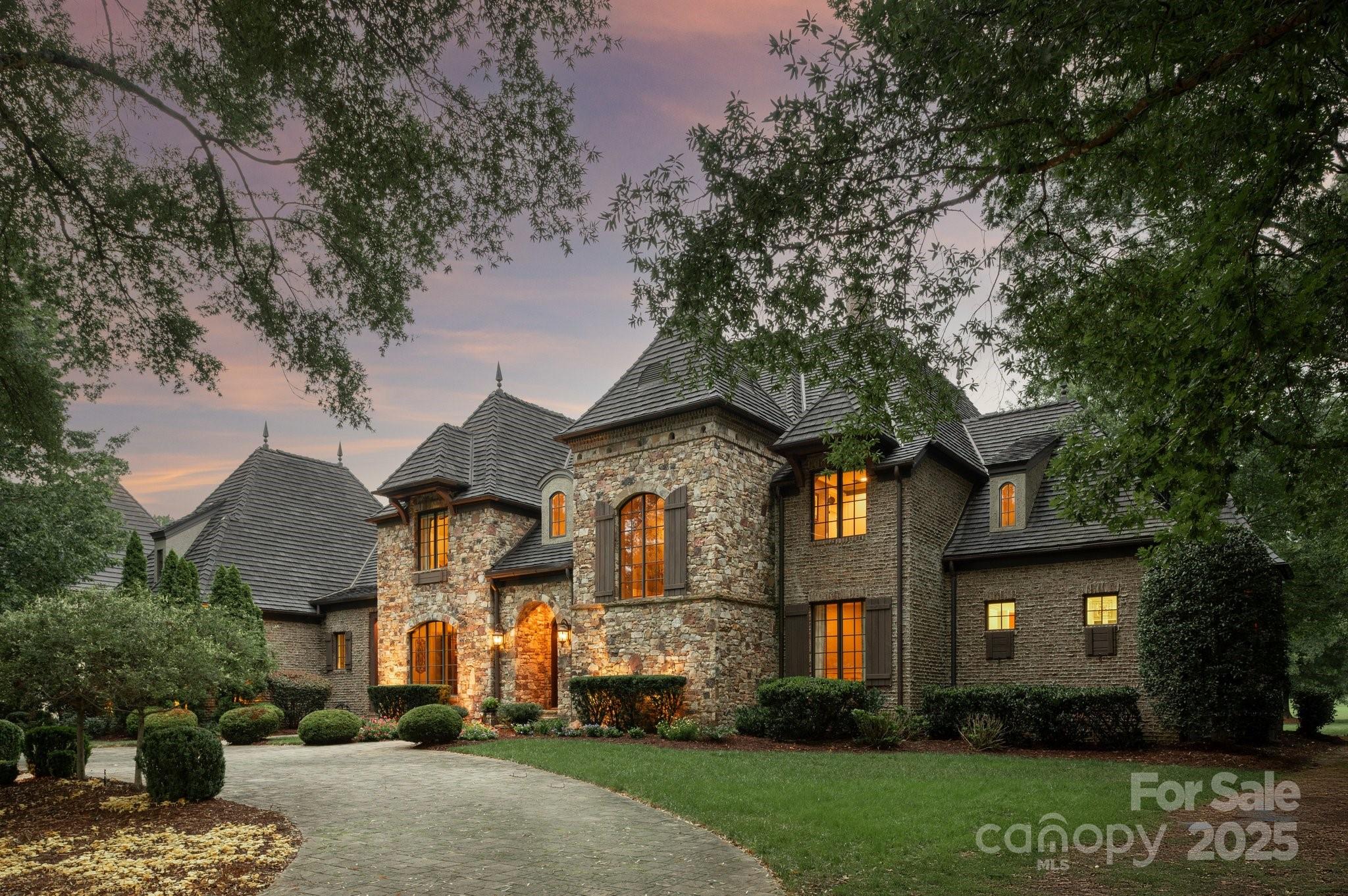 Exquisite French European–inspired estate in sought after gated, Longview Country Club. Set on a private .84-acre lot along the 12th fairway, this custom-built home offers over 8,000 SF of refined living and exceptional golf course views. This exclusive section of Longview is ideal for buyers seeking heightened privacy within the prestigious gated community.

Inside, every detail reflects superior craftsmanship—vaulted and coffered ceilings, rich architectural character, and seamless indoor-outdoor living with dual staircases and elevator access. The chef’s kitchen with dual islands opens to a spacious great room with fireplace and extends to a covered patio with outdoor grilling area and custom fireplace.

The main-level primary suite is a retreat of its own, featuring serene golf views, a spa-like bath, boutique-style closet, private laundry, and coffee bar. Upper levels include all en-suite bedrooms, a billiard room with bar, media /family room, and a third-floor flex suite with elevator access and full bath—perfect for guest or nanny accommodations.

Luxury, privacy, and timeless design converge in this rare Longview offering.