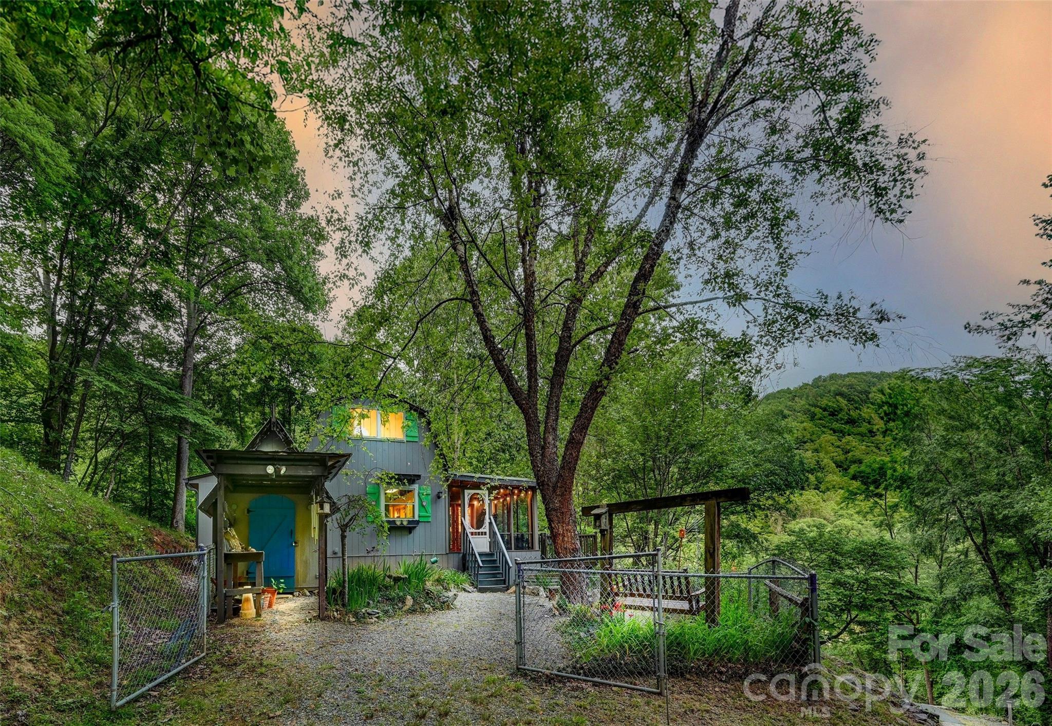 Tucked away on approximately 4 private acres, this enchanting 2-bedroom, 1-bath cottage offers the perfect blend of peace, privacy, and natural beauty. Surrounded by towering trees and serenaded by the sounds of nature, this hidden retreat feels worlds away while still offering the convenience of high-speed internet for remote work, creative pursuits, or streaming your favorite shows.

Wake each morning to visits from deer and local wildlife, spend quiet afternoons beside your private pond, or unwind in the gazebo while taking in the tranquility of the property. In the summer months, lush greenery creates a secluded woodland sanctuary, while winter reveals beautiful mountain views that add to the home’s storybook charm.

Whether you’re searching for a full-time residence, a second home getaway, or the ultimate writer’s or artist’s haven, this cottage inspires creativity, relaxation, and a slower pace of life. Cozy, inviting, and rich with character, this is the kind of property that captures your heart the moment you arrive.