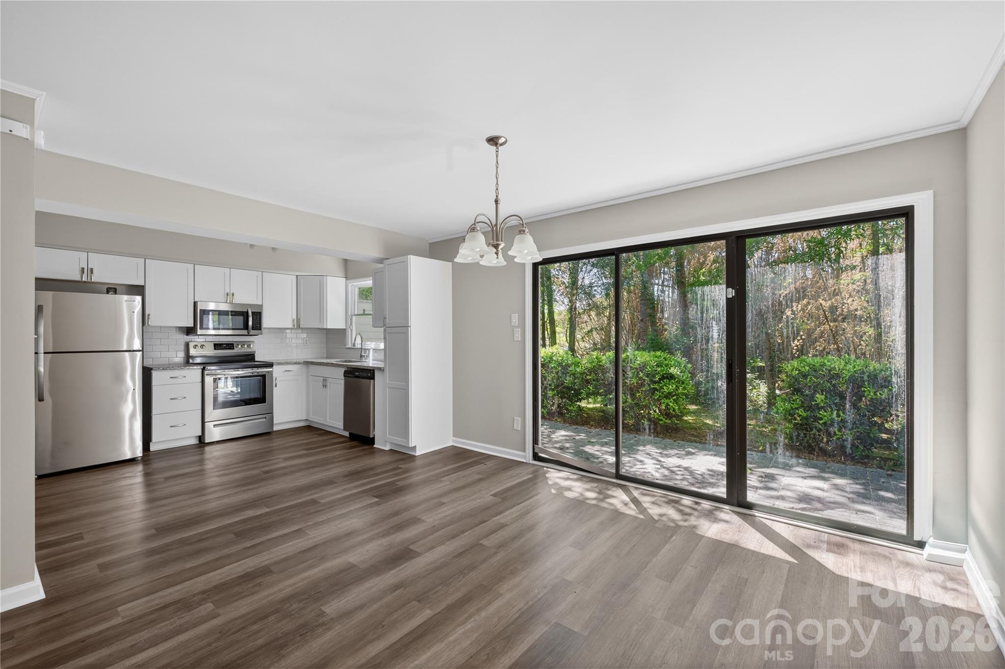 Beautiful End Unit townhome with fabulous outdoor patio and attached 1 car garage and carport! This 3 bed 2.5 bath home has been refreshed with LVP floors, updated lighting and fixtures and SS appliances. Walkable to McAlpine Greenway and McAlpine Park.