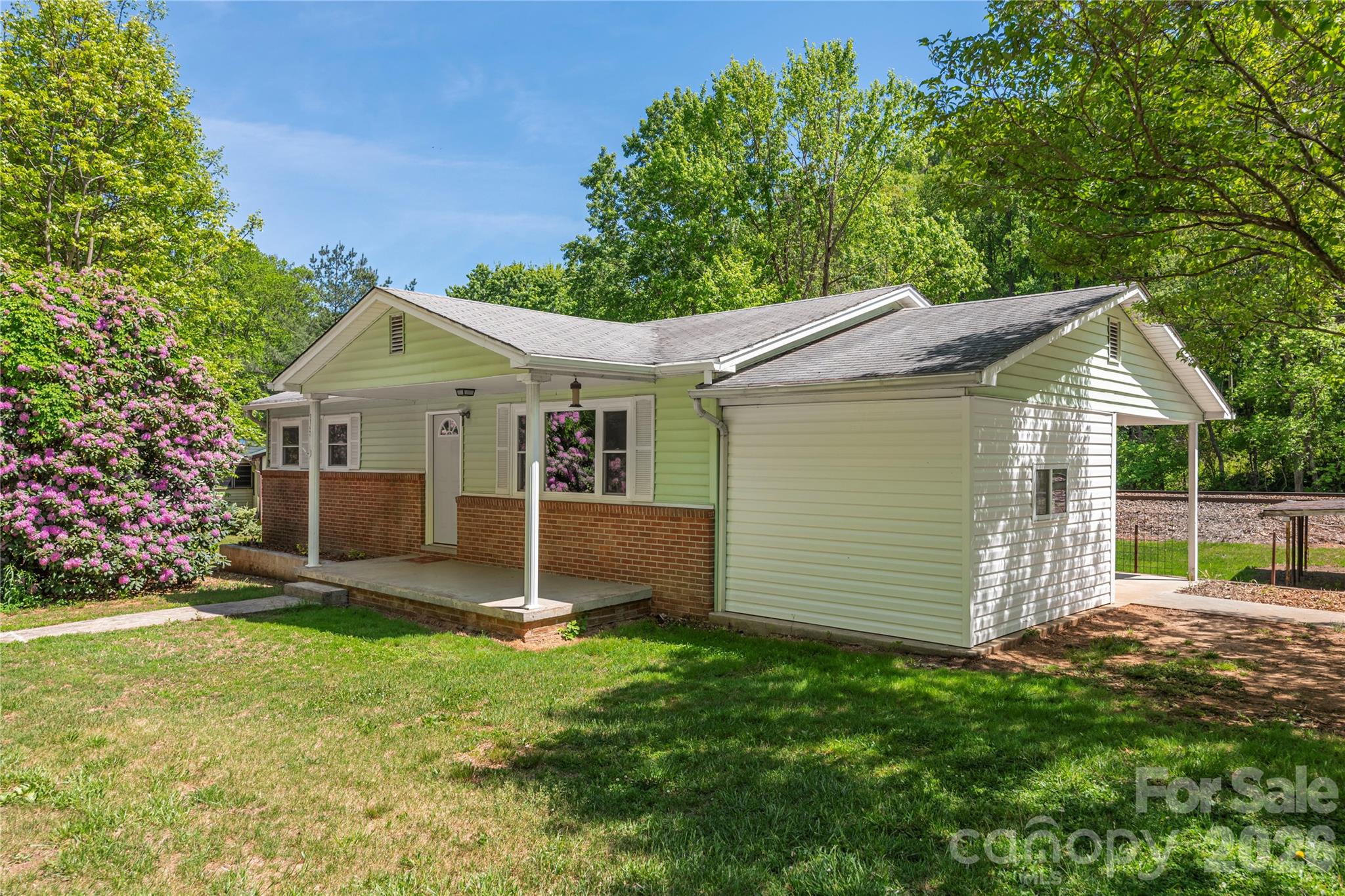 Charming bungalow in Canton located in the heart of the scenic Blue Ridge Mountains, offering the perfect opportunity for a starter home, vacation home, or investment property.  Conveniently situated just a short drive to Asheville, one of Western North Carolina's most sought-after destinations, known for its award-winning restaurants, craft breweries, live music, concerts, and vibrant nightlife.

Enjoy easy access to waterfalls, hiking trails, national forests, and outdoor recreation, making this property ideal for buyers seeking the best of mountain living in North Carolina.  Whether you're searching for a primary residence, short-term rental opportunity, Airbnb investment, or weekend getaway, this cozy bungalow delivers both location and lifestyle.

Experience the charm of small-town living with quick access to Asheville, the Great Smoky Mountains, and the Blue Ridge Parkway, making this home a standout in the Canton, NC, real estate market.