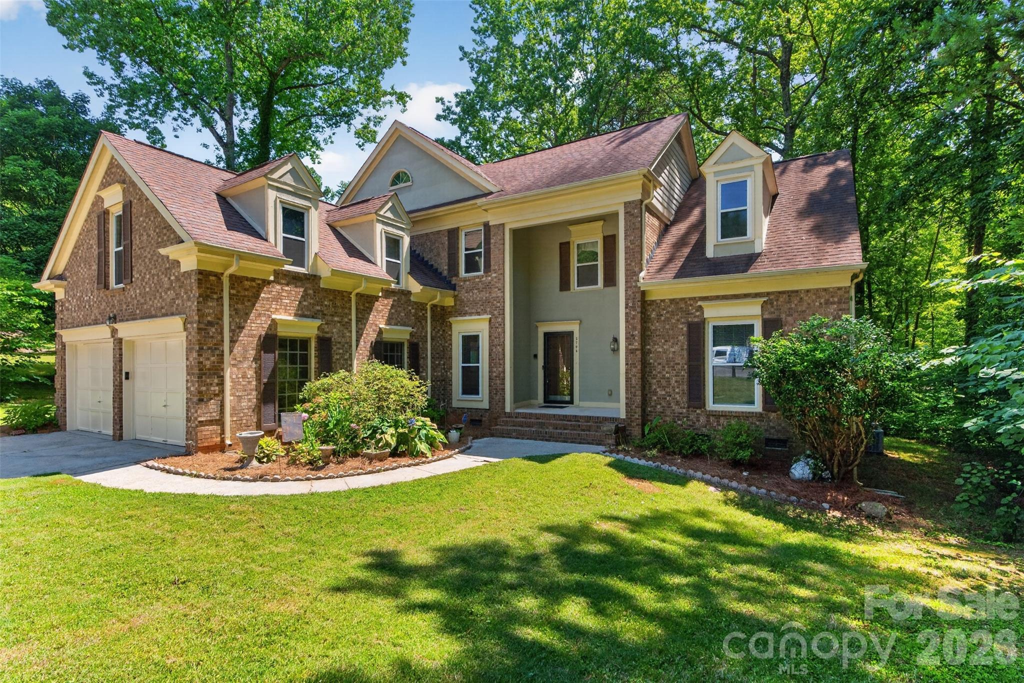Welcome home to this spacious 4-bedroom colonial tucked away on a private cul-de-sac in sought-after Mallard Grove! This master-down layout is a rare find in the neighborhood, offering single-level living convenience with three additional bedrooms and a large bonus room upstairs, ideal for a media room, playroom, or home office. The main level features gleaming hardwood floors, an updated kitchen, and a cozy family room centered around a fireplace. The primary suite is conveniently located on the main level, and new carpet has been added throughout much of the home. Enjoy your morning coffee on the covered front porch or unwind in the private, tree-lined backyard. Additional highlights include a cathedral ceiling, walk-in closet, and a 2-car attached garage. Just steps from your cul-de-sac, you'll find direct access to Mallard Creek Greenway, with easy access to shopping, dining, and major roads beyond that. Bring your vision and make this one your own!