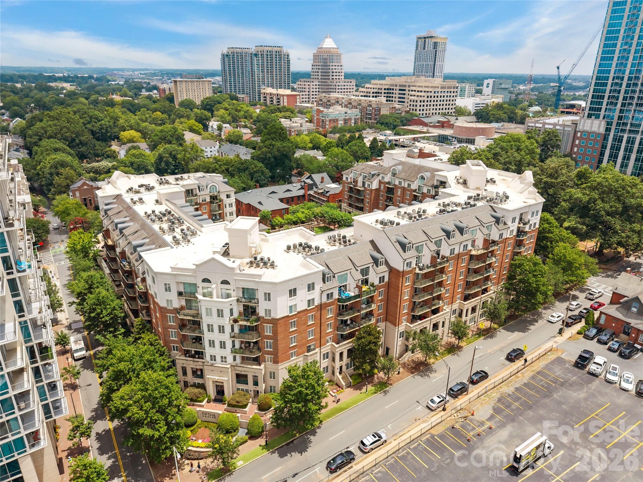 Experience resort-style living in one of Uptown Charlotte's most sought-after communities—Fifth & Poplar. Perfectly positioned in the charming, tree-lined Fourth Ward neighborhood, this beautifully maintained 1-bedroom, 1-bath condominium offers the ideal balance of vibrant city living and everyday convenience.
Inside, you'll find an open-concept layout featuring hardwood floors, granite countertops, ample cabinet space, and a spacious bedroom with a walk-in closet. Step outside to your private balcony and enjoy peaceful views overlooking Fourth Ward. Recent updates provide added value and peace of mind, including new carpet (2025), washer and dryer (2024), refrigerator (2023), and HVAC system (2022).
Beyond your front door, enjoy an unmatched amenity package including 24-hour concierge service, a resort-style pool, state-of-the-art fitness center, putting green, dog park, cyber café, resident lounge areas, and beautifully landscaped courtyards. The ultimate convenience awaits with Harris Teeter, dry cleaning, and additional services located within the building.
Walk to Charlotte's best dining, entertainment, sporting events, parks, and nightlife while enjoying the security and comfort of one of Uptown's premier gated communities. Whether you're a first-time buyer, professional, or looking for a low-maintenance city retreat, this is Uptown living at its finest.