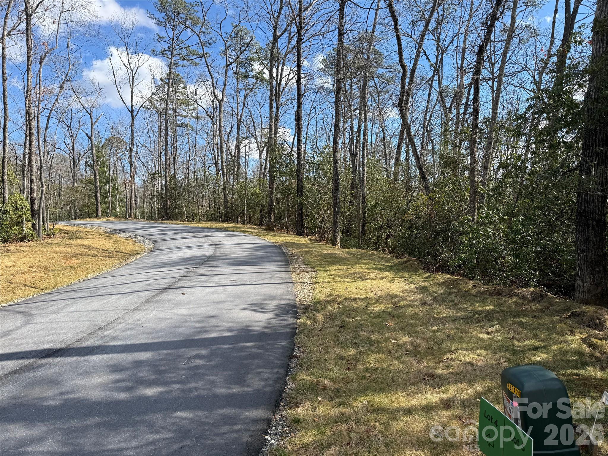 Welcome to a rare micro-neighborhood opportunity in the heart of Western North Carolina. Conveniently located between Hendersonville, Mills River, and Brevard this thoughtfully planned community features five oversized homesites perched along a gentle ridge, offering the perfect blend of privacy, natural beauty, and everyday convenience. Each lot enjoys excellent year-round sunlight. Mature hardwoods and native flora create a stunning canvas on which to bring your personal dream to life on. Generous lot sizes provide ample space to design your custom home with ample outdoor living areas, all with a peaceful sense of seclusion.
Easy-to-navigate roads make access simple and practical, ideal for year-round living or a mountain retreat. The topography is gently sloping offering flexible building sites without the steep grades often found in the mountains Located just minutes from the world-renowned trails, waterfalls, and outdoor adventures of Pisgah National Forest, this property places hiking, biking, fishing, and scenic drives right at your doorstep. Enjoy the serenity of a private mountain setting without sacrificing proximity to recreation and amenities. Build community with friends and neighbors at a shared shelter and firepit, and hike or bike from your backdoor on the ~1 mile neighborhood trail.