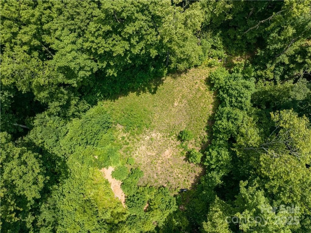 Huge potential views from these three combined parcels consisting of 6.27 acres. This high elevation, big view, property offers a highly desired SE to SW exposure within the fabled Plott Balsam Mountain Range. Choose your homesite location to build the mountain estate you've been searching for. This offering is located within the Sylva Vista Community consisting of mostly large lots with commanding long range views. This gated and private community is surrounded by the Sylva Watershed, Nature Conservancy and USFS Land. Seller has several other lots available to combine with this sale if interested. See MLS 3858768 for the master listing. Adjoining this offering is a 160+- acreage that could also be available with cascading waterfalls, large older forests, rock outcroppings and rare fauna and flora.