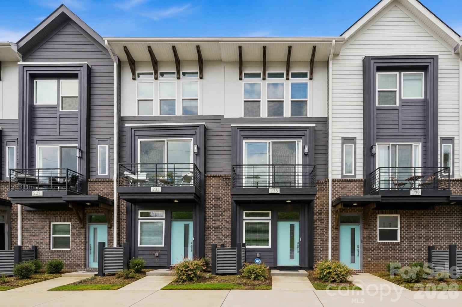 Modern, turnkey 3-story townhome built in 2023 by Empire Communities, ideally positioned just under 2 miles west of Uptown Charlotte. Recently refreshed with all-new interior paint and newly captured listing photography, this Cambria C plan offers a clean, move-in-ready presentation with a flexible layout designed for today’s lifestyle.

The home features a 1-car garage with private driveway parking, a first-floor flex room with powder bath ideal for a home office, gym, or secondary living space, and an open-concept main living level with abundant natural light. The kitchen is equipped with GE stainless steel appliances, gas range, counter-depth French door refrigerator, gray painted cabinetry, quartz countertops, and a large center island with built-in double trash pullout. Sliding glass doors open to a private terrace off the kitchen, creating an easy indoor-outdoor flow for entertaining or everyday enjoyment.

Both bedrooms are located on the third floor, along with a convenient laundry closet featuring an included stackable washer and dryer. The primary suite offers a private en-suite bath with gray cabinetry, quartz countertop, tiled flooring, and a fully tiled semi-frameless shower. The guest bedroom is served by a well-appointed full bath with coordinating finishes.

Located near parks, walking paths, biking trails, restaurants, breweries, entertainment, and Uptown Charlotte, this low-maintenance townhome offers modern convenience in a rapidly growing area with strong long-term appeal.