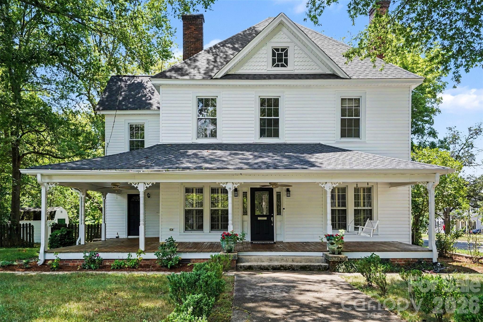 Located within one block of downtown Kings Mountain, this historic single family home offers over 1,800 square feet on the main level and exceptional classic details. Main level features include oak flooring, high ceilings, large crown molding and baseboards, a spacious primary bedroom, an office, and a dining room off the kitchen. Upstairs, you’ll find three large bedrooms and two full bathrooms with heart pine flooring. Outside, enjoy a large wrap-around front porch perfect for gatherings, along with a large driveway providing ample parking. Ideally situated within a short walk of restaurants, retail, and Patriot’s Park.  This home is located in the West Elementary School district.