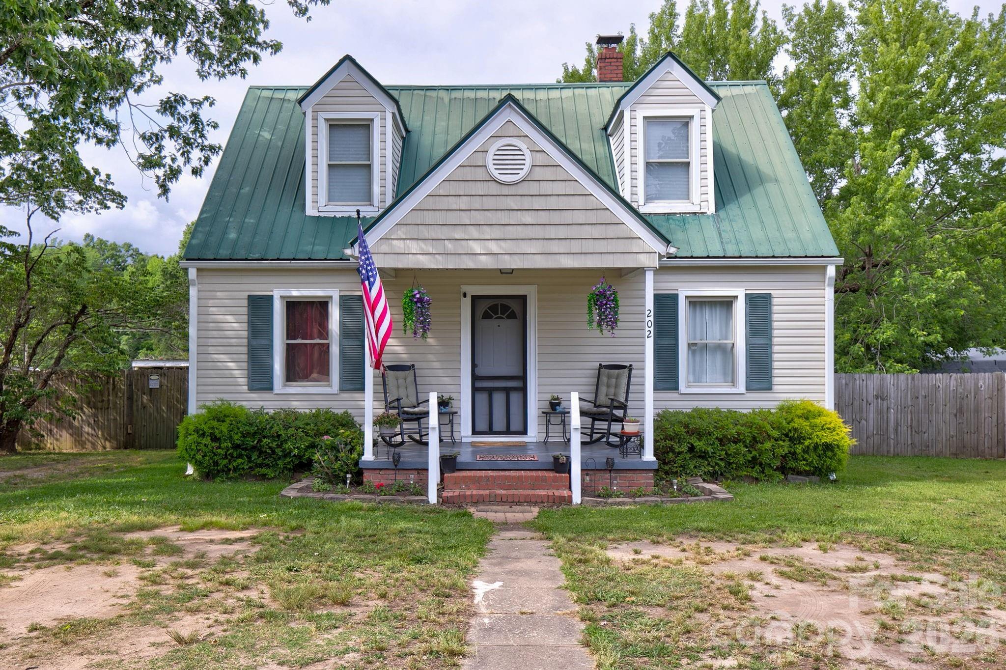 Looks like a dollhouse, feels like home!?
This charming Cape Cod cottage in Great Falls features 3 bedrooms, 1.5 baths, beautiful floors, an adorable front porch, and a fenced backyard on a .30-acre lot. Full of character, nostalgia, and cozy charm, it's the kind of home that steals your heart the moment you see it. HVAC - 2019, WH - 2016. 

8 minutes to I-77 and 45 min. to Columbia or Charlotte. Go see it and fall in love!