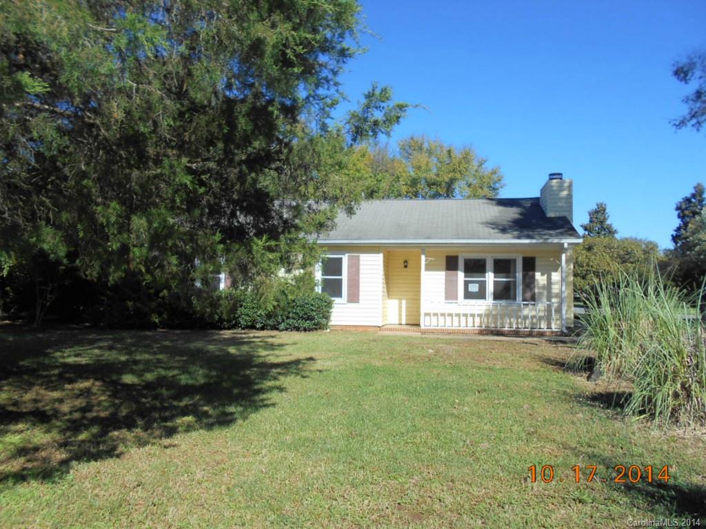 Cute ranch on a corner lot with a large back yard which is landscaped with trees and shrubs. Lots of ktchen cabinets and a wood burning fireplace in the living room.  The bathroom has been updated with newer cabinets, sinks and tub. New interior paint. Open floor pan with living room partially open to kitchen and dining area. Large bedrooms. Great convenient location close to downtown Rock Hill and interstate 77 . Selling "as is" .