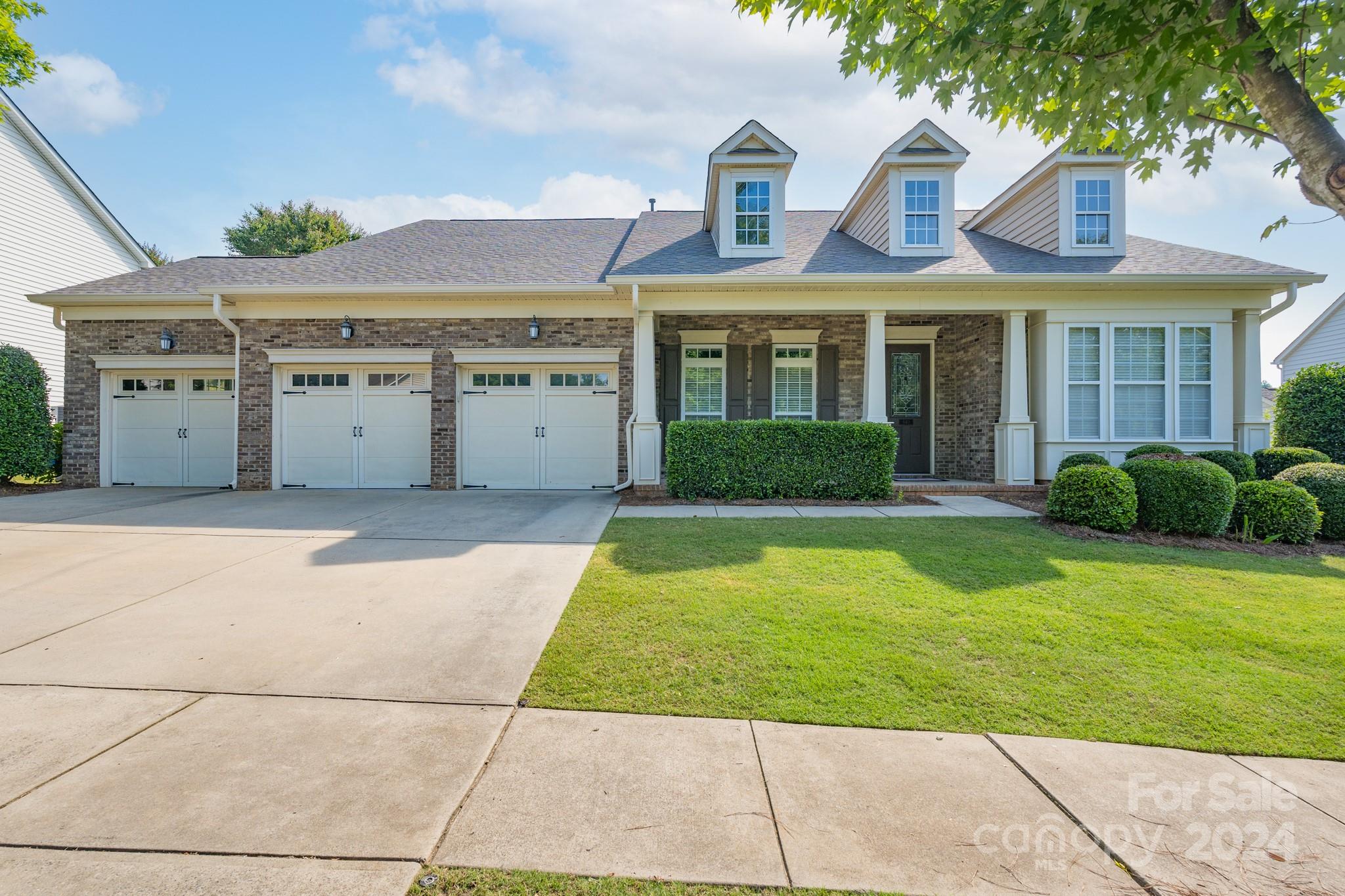 This home is ready for you to enjoy the primary bedroom/ensuite, as well as 2 more bedrooms with a Jack & Jill bath, dedicated office and laundry on the main level. The bedroom/bonus space on the second level has full bath and closet. The 3 car garage & all it's storage, sink and separate door to the backyard is a bonus. Relax & enjoy the screened porch, extended patio out back & front porch. This home has a NEW ROOF, a fresh coat of paint on the majority of the interior, and NEW CARPET. The quartz countertops, irrigation in both front/rear, blinds throughout, and fantastic layout are sure to impress. This neighborhood is in the highly-sought-after Fort Mill School District & offers 2 entrances in/out, sidewalks on both sides of street, outdoor pool, clubhouse, airnasium, playground & pickleball court. PKMS is currently on an enrollment freeze-check FMSD for details.