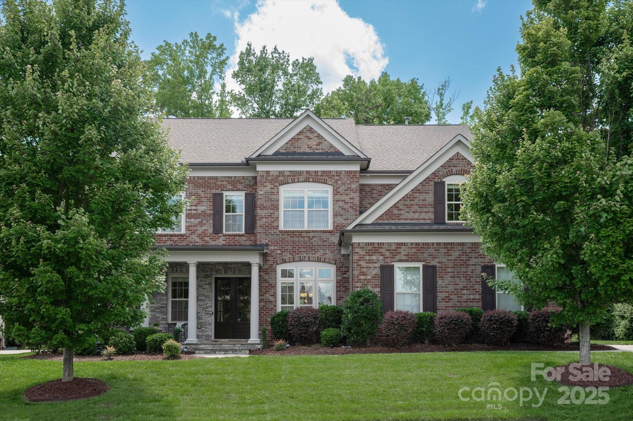 Beautiful full brick, 3 car garage home in popular Bridgemill community just 5 mins to the new CrossRidge Center which includes Target, , restaurants & shopping! Main floor features an office, large drop zone + a guest suite w/ full bath including tiled walk in shower.  Gorgeous kitchen includes a spacious counter level height island w/ quartz tops, large farm sink, gas cooktop & a walk in pantry. Second floor features a primary suite w/ HUGE walk in closet and primary bath with his & her vanities w/ quartz tops & a large tiled shower. Upstairs also includes a secondary bedroom w/ an en suite full bath & 2 additional bedrooms w/ a shared oversized secondary bath. The generously sized bonus room provides a great flex space. 400+sf unfinished 3rd floor provides a great opportunity for expansion or great storage space!  Take in the great NC weather from the covered front porch or private patio in the perfectly manicured backyard. Interior freshly painted! New carpet! Updated lighting!