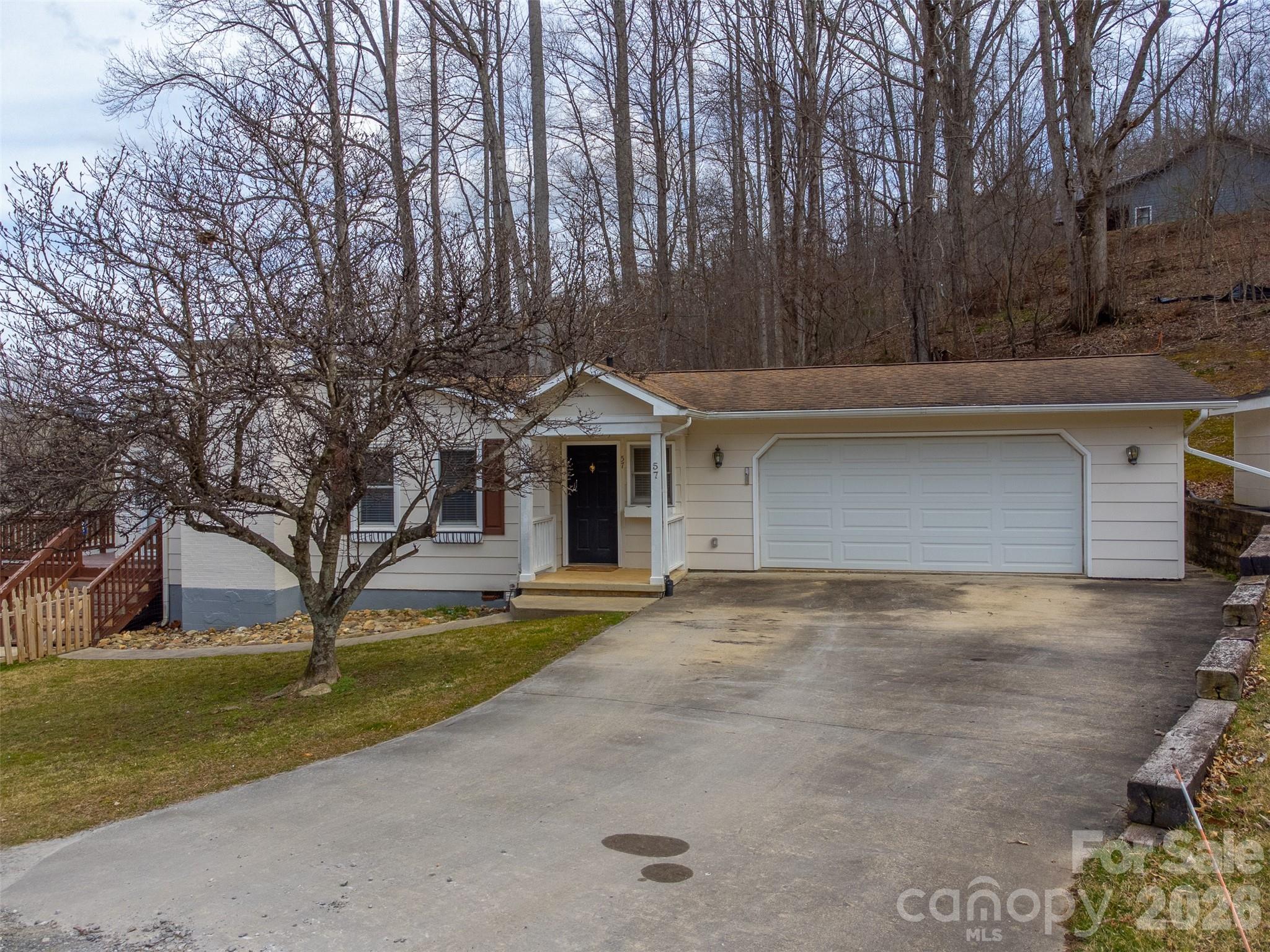 Welcome to 57 Melody Lane in Maggie Valley, North Carolina, a charming mountain home offering the convenience of all on one level living. Filled with natural light, the home features large windows that create a bright and welcoming atmosphere throughout. This home also includes a new handicap-accessible shower, providing added comfort and accessibility. The thoughtful layout makes it ideal for those looking for easy living, whether as a full-time residence, vacation getaway, or investment property. Located in the heart of Maggie Valley, you’ll enjoy peaceful mountain surroundings while still being close to local dining, shops, outdoor recreation, and scenic drives along the Blue Ridge Parkway.