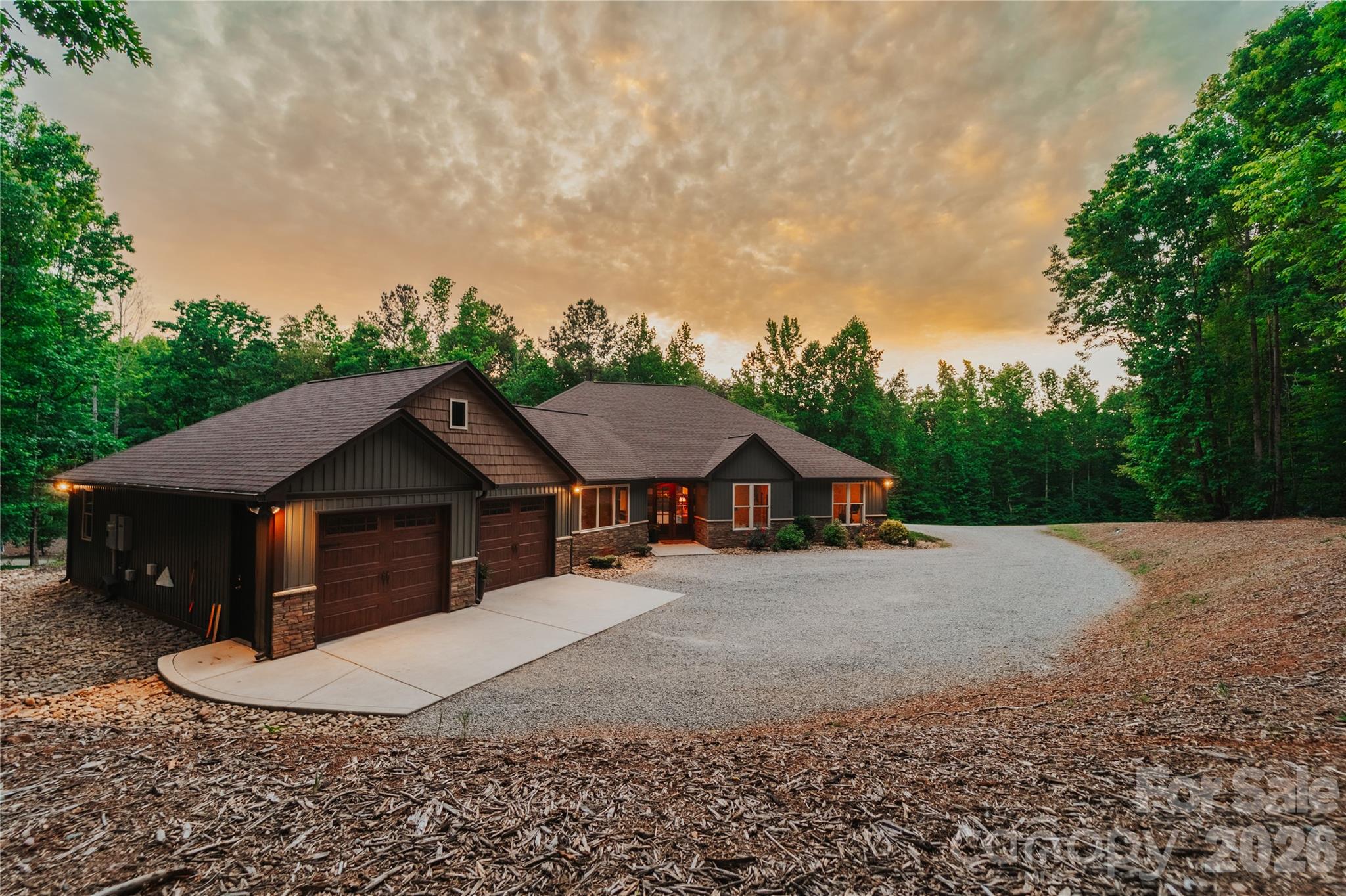 Imagine pulling up to your own private gated entrance and instantly feeling that deep sense of “I’m finally home.” This stunning property sits on over 19 acres of peaceful, tree lined privacy, and delivers everything you’ve been dreaming of and more!

The moment you step inside, you’re greeted by an impressive foyer that flows into a warm, open concept living space. Soaring vaulted ceilings and a cozy fireplace in the living room set the tone for relaxed evenings and unforgettable gatherings. 

The oversized gourmet kitchen is an absolute showstopper and is loaded with high-end KitchenAid appliances, a massive breakfast bar, incredible prep space, a huge walk-through pantry, and a dedicated coffee bar that’s perfect for lazy mornings or entertaining guests. 

Just off the kitchen, the sun drenched three season room with its own fireplace feels like your personal sanctuary. Picture yourself curled up with a book, watching the sunlight dance through the trees, or stepping out onto the expansive patio overlooking your private pond, fire pit, and garden. This is where memories will be made.

The thoughtfully designed split-bedroom layout gives everyone their own space. The primary suite is pure luxury vaulted ceilings, a spa-like ensuite with his-and-hers sinks and a beautifully tiled shower, plus a massive walk-in closet that leads into an exceptionally functional laundry room. Complete with storage galore, a laundry sink, and folding counter. 

On the other side of the home, you’ll find a large bedroom with its own full bathroom that is ideal for guests or as a second primary ensuite. Two additional bedrooms share another full bath, and one includes a charming loft that’s included in the sale. 

A spacious office with built-in desks and a half bath offers the perfect work-from-home setup, with convenient access to the two-car garage. The garage is complete with extra bump-out space perfect for a home gym or additional storage.

But the real wow factor? Your completely separate barn/venue. This is pure entertainment magic. Huge sliding barn doors open to a massive event space with its own full kitchen and bathroom that is perfect for weddings, parties, holiday gatherings, or whatever your heart desires. 

Upstairs you’ll find over 750 square feet of storage, a cupola that fills the space with natural light, and a fully finished one bedroom apartment with its own private back porch overlooking the pond. This is the ultimate bonus space most people only dream about this isn’t just a house, it’s a lifestyle. Privacy, luxury, and ready for you to move in and start living your best life immediately. Homes like this don’t come along often. Don’t wait, schedule your showing today and make this extraordinary property yours before someone else does.
