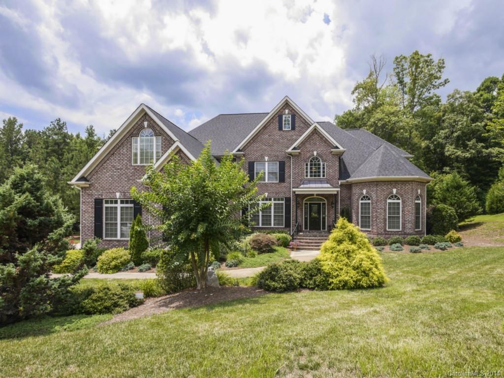 Amazing views of the "Park-Like" 1+ acre yd through the 2 sty "Wall of Windows" in both the GR & Morning rm. All brick hm w/ lovely architectural detail-elegant trim, high ceilings, arched doorways, hardwd flrs, wrought iron spindles & 8' doors thru-out. Gourmet kit w/huge work island, granite, tile bksplsh, hickory cabs, SS appls, walk-in pantry, bayed bkfst nook. Master on Main, huge bonus rm, walk-up attic w/ tremendous storage.  Raised patio w/ gas line for grill, paver patio w/firepit