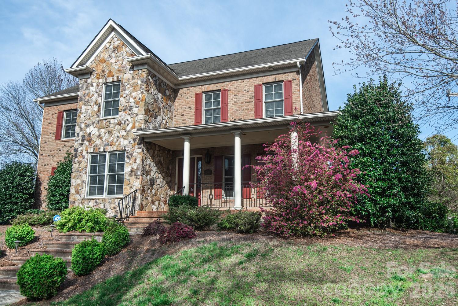 Main-Level Primary Suite | Cul-de-Sac Living | Wraparound Porch | 5 Bedrooms | South Charlotte Lifestyle

Tucked on a quiet cul-de-sac in one of South Charlotte’s most established neighborhoods, 2616 Ladley Court delivers the kind of space, character, and everyday livability that’s increasingly hard to find.

A welcoming stone exterior and wraparound front porch set the tone for a home that feels both grounded and inviting. Inside, nearly 4,000 square feet unfolds with warm hardwoods, abundant natural light, and a layout designed for real-life flexibility.

The main-level primary suite offers rare convenience and privacy, while multiple living areas and flexible rooms support everything from work-from-home to multi-generational living. A spacious bonus room easily transforms into a media space, playroom, gym, or guest retreat.

At the center of the home, the kitchen and family room connect seamlessly, creating an easy flow for daily living and entertaining. Built-ins and generous gathering spaces give the home both function and character.

Upstairs, four additional bedrooms provide comfort and separation, making it easy to accommodate family, guests, or evolving needs.

Out back, a private patio and integrated surround sound system set the stage for effortless outdoor living, from quiet evenings to game-day gatherings.

Located minutes from SouthPark, top-rated schools, dining, shopping, and recreation, this home blends space, setting, and lifestyle in one of Charlotte’s most desirable corridors.