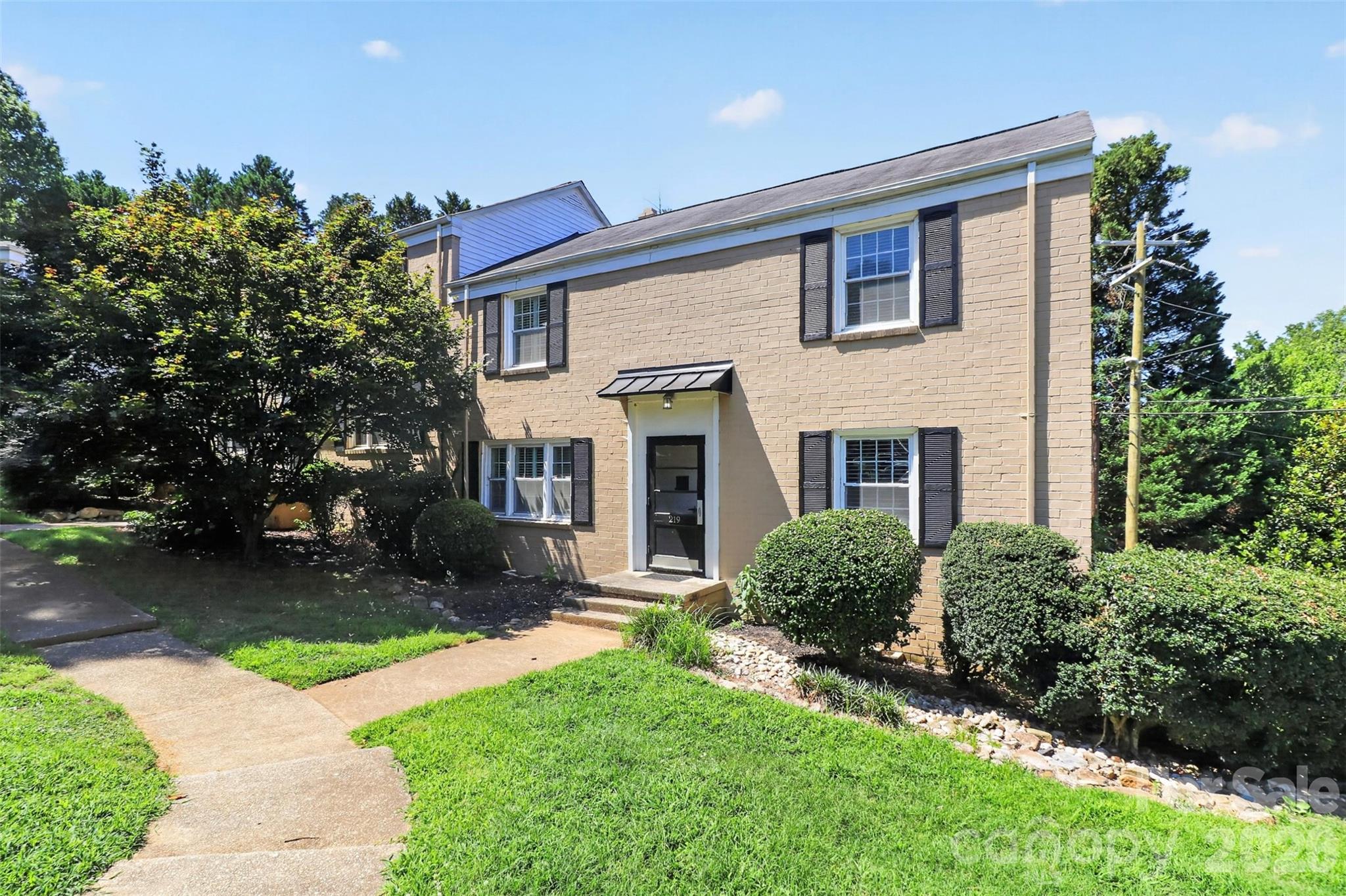A Selwyn Village gem, find true hardwood floors throughout both levels, a rare main-level powder room, and a sleek, modern kitchen featuring granite countertops, cream cabinetry, stainless steel appliances, and updated fixtures. The open-concept living and dining area creates an inviting space for both entertaining and daily living. Upstairs, two spacious bedrooms and a beautifully updated full bath offer the perfect combination of comfort and functionality. Plantation shutters, custom closet systems, and convenient upstairs laundry add to the home's appeal

The location is hard to beat. Just minutes from SouthPark, Park Road Shopping Center, Montford Drive, and the heart of Myers Park, you'll enjoy easy access to some of Charlotte's best restaurants, shopping, and entertainment. Even better, direct access to the Little Sugar Creek Greenway is right outside your door, offering miles of trails for walking, running, biking, and enjoying the outdoors.

Move-in ready, beautifully updated, and perfectly located—this is Myers Park living at its best.