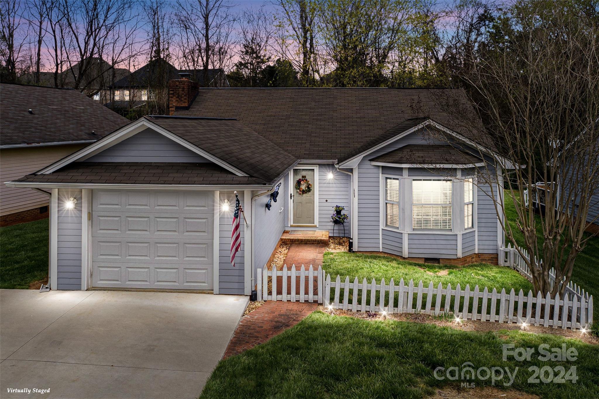 Multiple offers recieved, highest and best by 6PM 5/18.  Cottage-style home with a full garage and the carefree lifestyle of a condo is LIKE NEW!  Nestled deeply on a quiet cul-de-sac with a lush tree-lined backyard within Mulberry Village.  Accessible OPEN FLOOR PLAN boasts vaulted ceilings, a gas fireplace, and natural light.  UPDATED KITCHEN, with STAINLESS STEEL appliances and NEW GRANITE counters, opens to a PRIVATE DECK for outdoor living.  The generous owner's retreat has an expansive bay window and an updated en suite with a walk-in shower and NEW vanity.  MOVE-IN READY; fresh paint, newer floors, newer HVAC, NEW extended driveway...  Prime location near I-77, healthcare, shopping, dining, business, and coveted Fort Mill Schools.  The 2ND LIVING AREA could easily be converted into a 3rd BEDROOM with its deep closet.  This savvy investment opportunity with low taxes has only been lovingly owner-occupied.  Ask about 1% preferred LENDER INCENTIVES! And ALL of the appliances stay!!