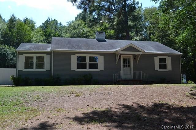 Cute as can be!  Updates include new windows, new tile flooring in kitchen and laundry, new blinds, new paint throughout, newer gutters and siding.  Large living room and dining area, spacious kitchen, den and sun room. 
 Wired outbuilding and carport.