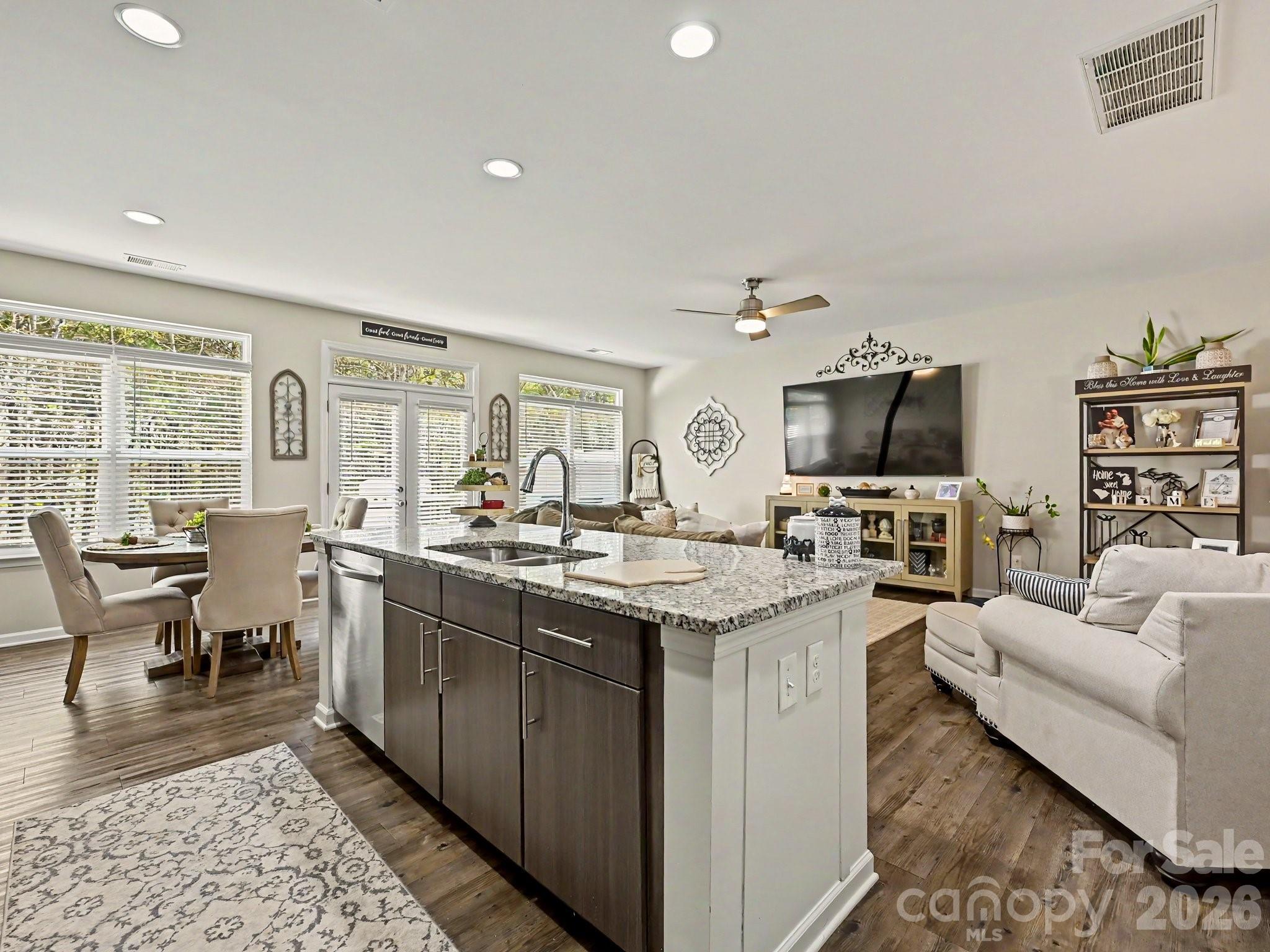 Welcome to this stunning 3-bedroom, 2.5-bath townhome at 2704 Cregstone Way, where modern elegance meets effortless living. Built in 2019, this meticulously designed residence spans 2,129 square feet and boasts an inviting open floor plan that radiates warmth and sophistication. As you step inside, you’ll be captivated by the gleaming vinyl plank flooring that flows seamlessly through the spacious family room, which effortlessly connects to a gourmet kitchen adorned with luxurious granite countertops, abundant cabinetry, and a generous island perfect for culinary creations. The sun-drenched breakfast area and family room provide a picturesque view of the private patio, framed by lush trees, offering a serene escape for relaxation or entertaining. Upstairs, discover three generously sized bedrooms, a versatile loft, and a convenient laundry area, with the primary suite serving as a true sanctuary, featuring an en-suite bathroom complete with a garden tub, separate shower, dual vanities, and an expansive walk-in closet. Nestled in the desirable Regent Park community, enjoy access to fantastic amenities including a sparkling outdoor pool, tennis courts, walking trails, and a vibrant clubhouse. With its prime location near I-77, Kingsley, ASC Greenway, Riverwalk, and Carowinds, this exquisite townhome is a rare find at $399,000, offering both comfort and convenience in one remarkable package!