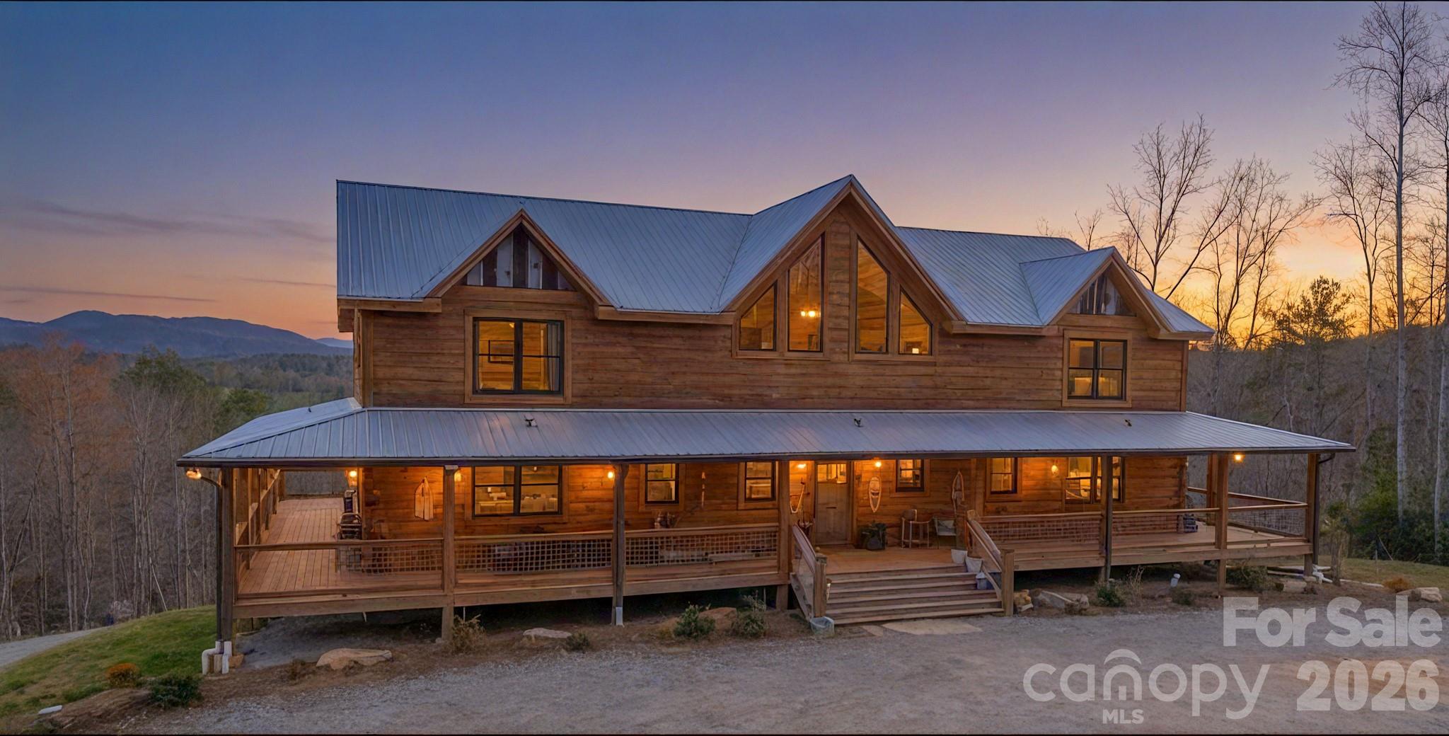 Grand rustic lodge in Blue Ridge Mountains, extraordinary 3-year old log residence, handcrafted artistry and unspoiled wilderness.  104 acres bordered by 400+ acres conservation land, permanently protected, a signature private estate.  9357 square foot home , Grand Living Room with cathedral ceilings, 5 Bedrooms,  four full baths, one half bath , two large family rooms, four flex rooms, professional chef's kitchen, dining area, walkthrough service pantry, walkthrough laundry/mudroom. Primary on main with ensuite, walk-in rainfall shower, spa tub, discreet toilet closet and urinal. double vanity with hand-scribed petrified wood sink basins.  Custom smart lighting, rustic chandeliers, handcrafted textured white pine walls.  5621 square foot barn with 955 square feet of finished space.  Barn includes professional catering/prep area with hotbox, bakery case, commercial sink and equipment.  Private well and septic system.  Two-acre fenced pasture with barn and sep. water source. Two miles of horse/ATV trails on-site.  Excellent hunting on property.  Property could be a grand residence, an outdoorsman venue, a bed and breakfast--so many possibilities!