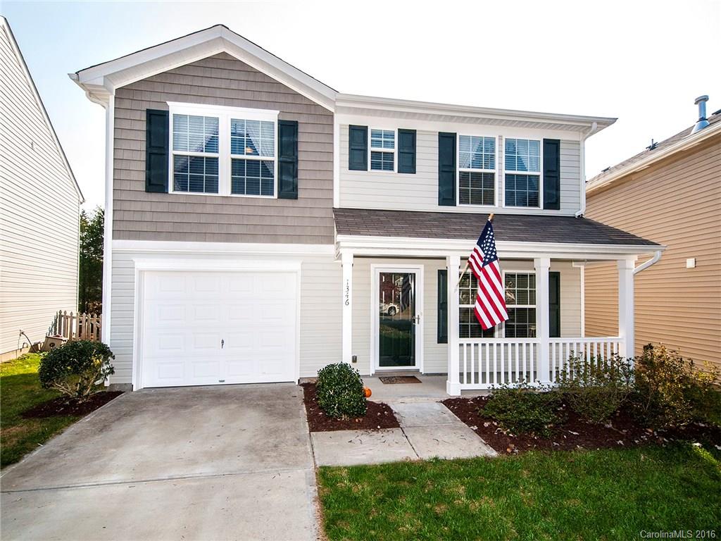 This is the home your buyers have been looking for in the Charlotte Metro area!  Three well-appointed bedrooms with large master en suite occupy the entire second level.  On the first floor is a large open concept great room.  The kitchen is gorgeous with substantial cabinetry, black appliances and a bar.  The kitchen overlooks the living room. The home is on a circle directly across from large common area and playground. Huge deck off the back of the home.  Flat driveway and front porch!