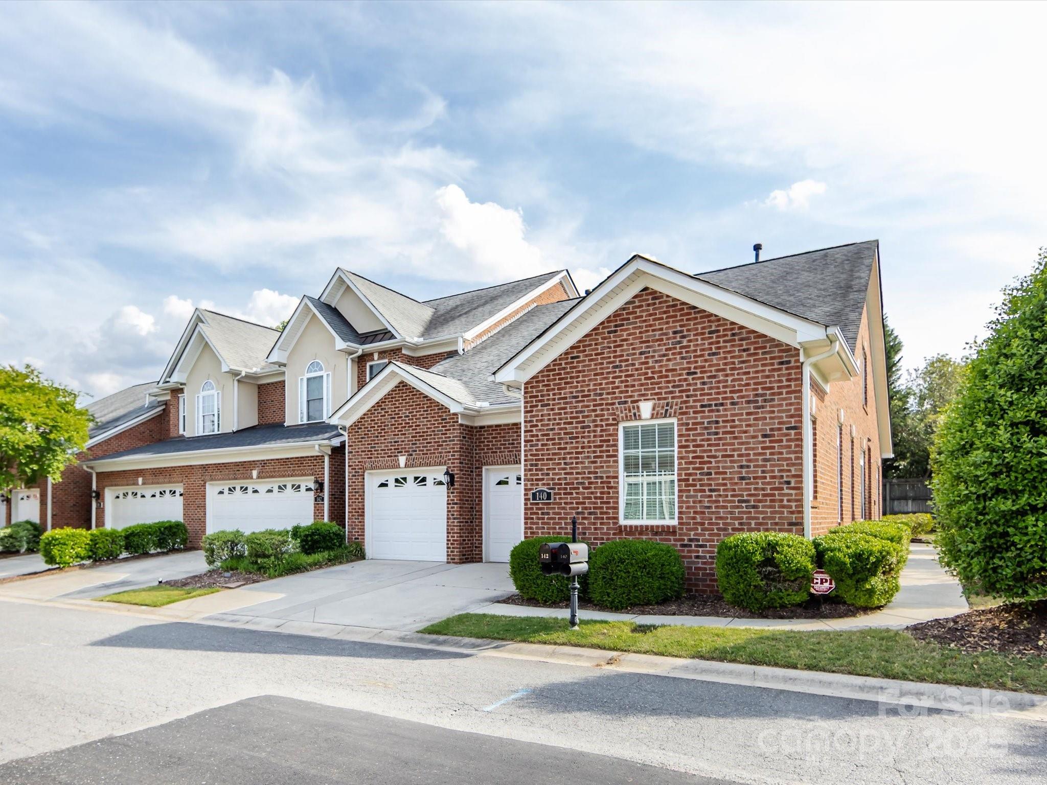 Full brick, former model townhome in sought after Gated Community of Beacon Knoll Villas. Beautiful community with neighborhood pond. Light and airy with all new interior paint. Open floor plan features large great room with built-in bookcases and gas log fireplace. Open to the charming dining area. Kitchen features rich kitchen cabinets, stainless appliances and granite counter tops. Breakfast area overlooks the brick walled courtyard. Brand new low deck highlights a welcoming dining spot. Split floor plan with large primary suite. En suite bath with double sink vanity, walk in closet and jacuzzi tub. On other side of the main floor is the second bedroom and full bath. Upstairs is a bedroom, office space and full bath. Walk in storage. Two car garage with storage closet. Under the staircase storage inside, gives this home flexible storage options. Comporium Fiber Optic installed last year. Direct TV satellite dish included. CPI security system included. 2022 AC, new disposal 2023.