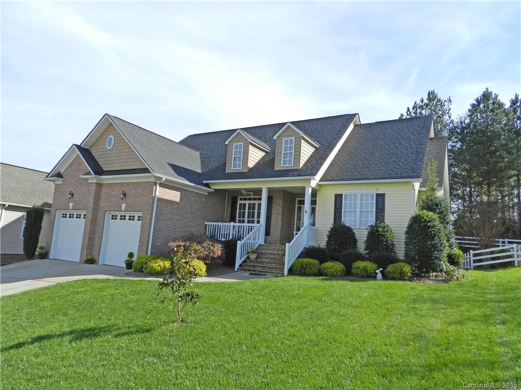 Adorable ranch style home, well appointed with custom finishes including heavy moldings & trim detail. Modern design floorplan. Bar kitchen with granite ctops & rich cherry cabinetry.  Stainless appliances (refrig included). Gleaming hardwood floors.  Double trey ceiling and sitting area in master. Split bedroom plan. Custom homes within community. Close to shopping and amenities. Community swimming pool is walking distance from the home. Screen porch, fenced yard, irrigation. Private rear.