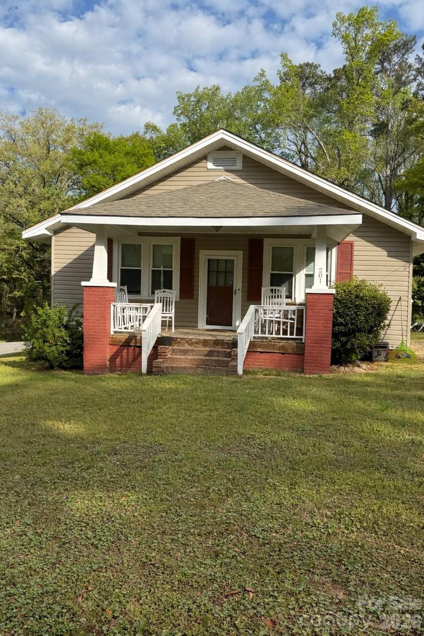 Charming 3-bedroom, 1-bath home situated on a desirable corner lot in Wadesboro! Conveniently located within walking distance to uptown amenities including dining, hardware store, pharmacy, theatre, and more. The interior has been freshly painted, offering a clean and inviting feel throughout. Enjoy relaxing on the covered front porch or unwind on the screened-in back porch. The dining room features a beautiful built-in china cabinet, adding character and charm. Perfect for those seeking small-town living with easy access to everyday conveniences—don’t miss this great opportunity!