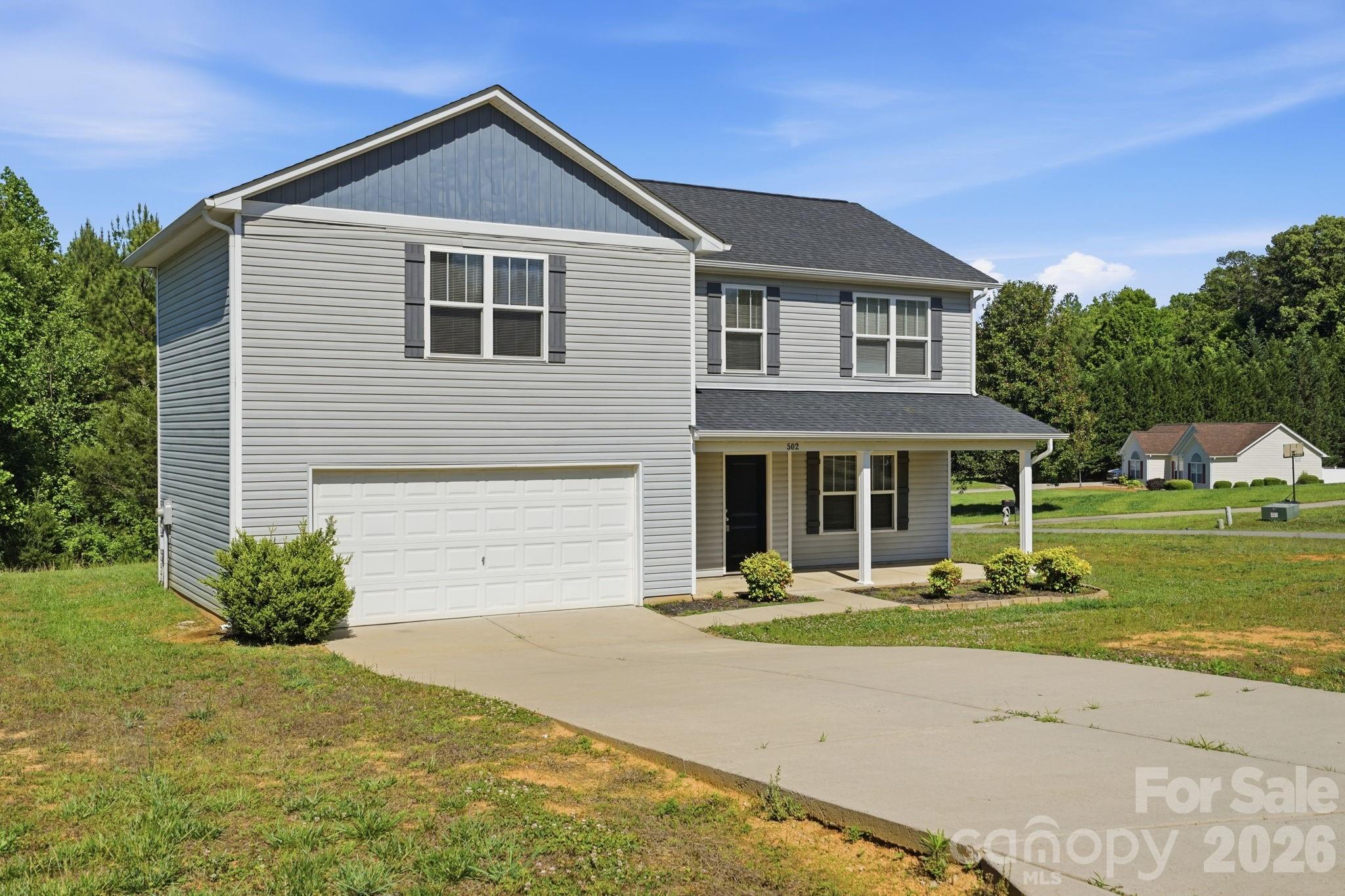 Charming 2-story home featuring 3 bedrooms, 2.5 bathrooms, and a 2-car garage with a functional layout designed for comfortable living. The inviting front porch adds great curb appeal and provides the perfect spot to relax. Inside, the main living areas offer plenty of natural light and space for everyday living and entertaining. The kitchen provides ample cabinet and counter space, while the spacious primary suite includes a private bath. Additional bedrooms offer flexibility for guests, a home office, or hobbies. One or more photo(s) was virtually staged.