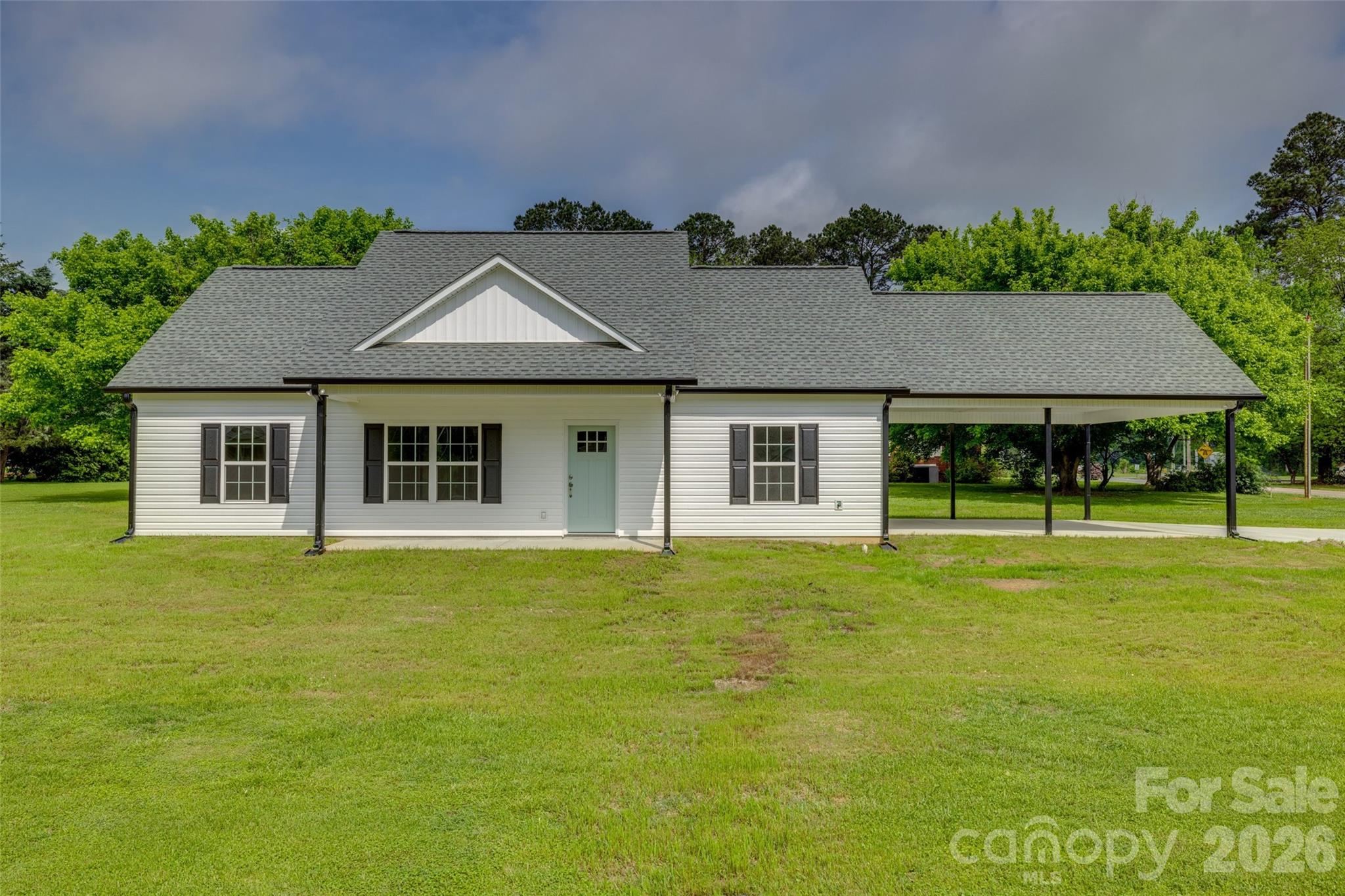 Brand new construction on nearly an acre—this one gives you the space you’ve been looking for without sacrificing convenience.
Located in Fort Lawn, SC, this 3-bedroom, 2-bath home offers a clean, open layout designed for how folks actually live. The main living areas feature durable LVP flooring that looks sharp and holds up to everyday life, while the finishes throughout bring a modern, stylish feel.
The kitchen flows right into the living space, making it easy to cook, gather, and stay connected whether it’s a regular weeknight or a house full of guests. Everything here is built with functionality in mind.
Step outside and you’ll appreciate that nearly an acre gives you room to play, garden, entertain, or just enjoy a little breathing room. The covered two-car carport and oversized concrete driveway add flexibility for parking, projects, or play.
You’re getting a move-in ready, thoughtfully built home with quality craftsmanship, all in a location that keeps you within reach of nearby towns and major highways.
If you’ve been waiting on new construction with land… this is it. Schedule your showing before someone else beats you to it.
