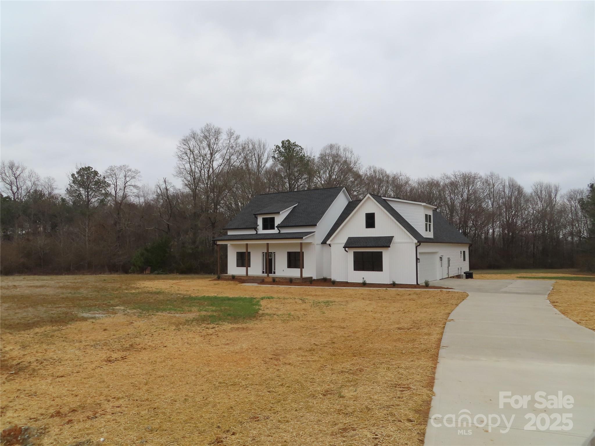 New construction sitting on 3.75 acres ( includes 2 lots). Easy commute to Charlotte, Rock Hill, York, Clover & more.
Looking for a Farmhouse style Home? Here it is! As you enter the house through the foyer, the house has an open floor plan and a dining room. Easy to entertain with your family and friends with covered porches on the front and back of the house. Any cook will love the kitchen with it's walk in pantry, kitchen island, plenty of cabinets and a sink looking over the backyard. Private laundry room ( not at garage entry). The back hallway can easily accommodate a home office desk area. House comes with an extra lot so making a place for additional family members would be possible. House should be complete around the end of January or sooner.
Pictures are of another home identical to this one except no bathroom in the bonus room and black windows on the front of this one.