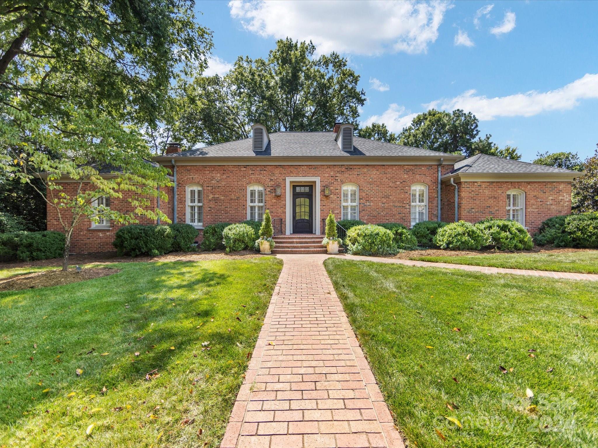 Enjoy spacious living on a quiet cul-de-sac in the heart of Foxcroft with this 4 bed, 4 bath brick home. Formal living and dining rooms border the gracious front entry.  Covered side entry leads to laundry, mud room, half bath and a light filled eat-in kitchen which provides ample storage space.  Family room french doors open to the screened porch overlooking the thoughtfully landscaped backyard and beautiful rose garden. The split floor plan provides primary suite privacy.  The lower level offers flex space for office/play as well as the 4th bedroom and full bath.  Lower french doors open out to a brick patio.  Carport provides covered parking and extra storage. A block from Foxcroft Hills Swim Club, this home is conveniently located to public/private schools and all the amenities of Southpark.