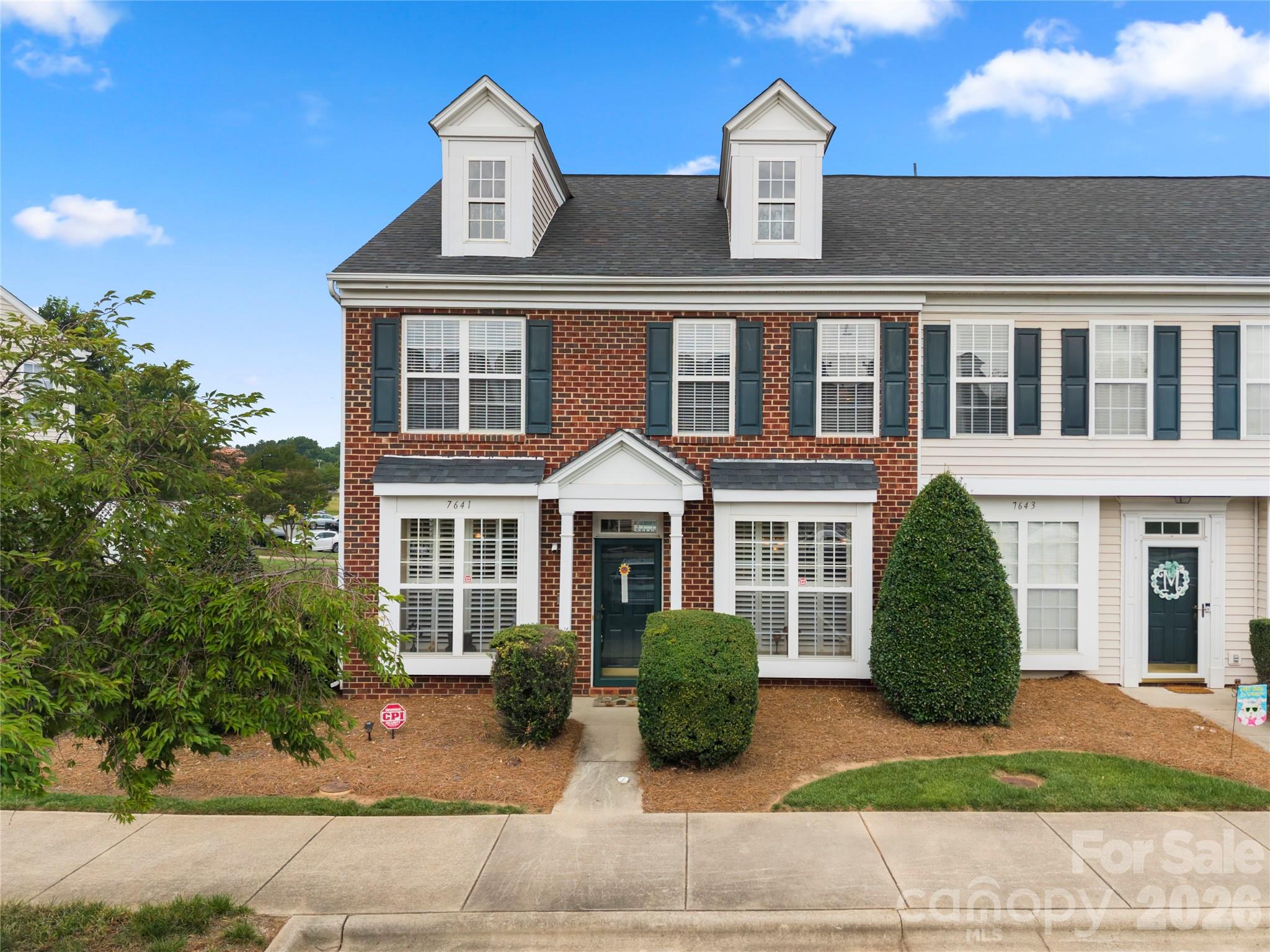 Beautiful end-unit townhome in Bluffs at Waterside Crossing! This spacious 3-bedroom, 2.5-bath home offers over 1,800 sq ft with an inviting open floorplan, abundant natural light, and plenty of room to make it your own. The main level features a welcoming entry with crown molding and chair railing, a well lit dining area, spacious kitchen with pantry, and comfortable living area complete with a cozy gas fireplace. Upstairs, the primary suite features a tray ceiling, chair railing, crown molding, walk-in closet, and en-suite walk in shower. Two additional bedrooms, a full bath, and convenient upper-level laundry complete the second floor. Enjoy the private patio with partial privacy fencing and additional storage space. Located in a sidewalk-lined community with outdoor pool, street lights, and exterior maintenance included through the HOA, this home offers low-maintenance living with easy access to shopping, dining, Lake Norman, and all that Denver has to offer. A wonderful opportunity to own in a fantastic location!