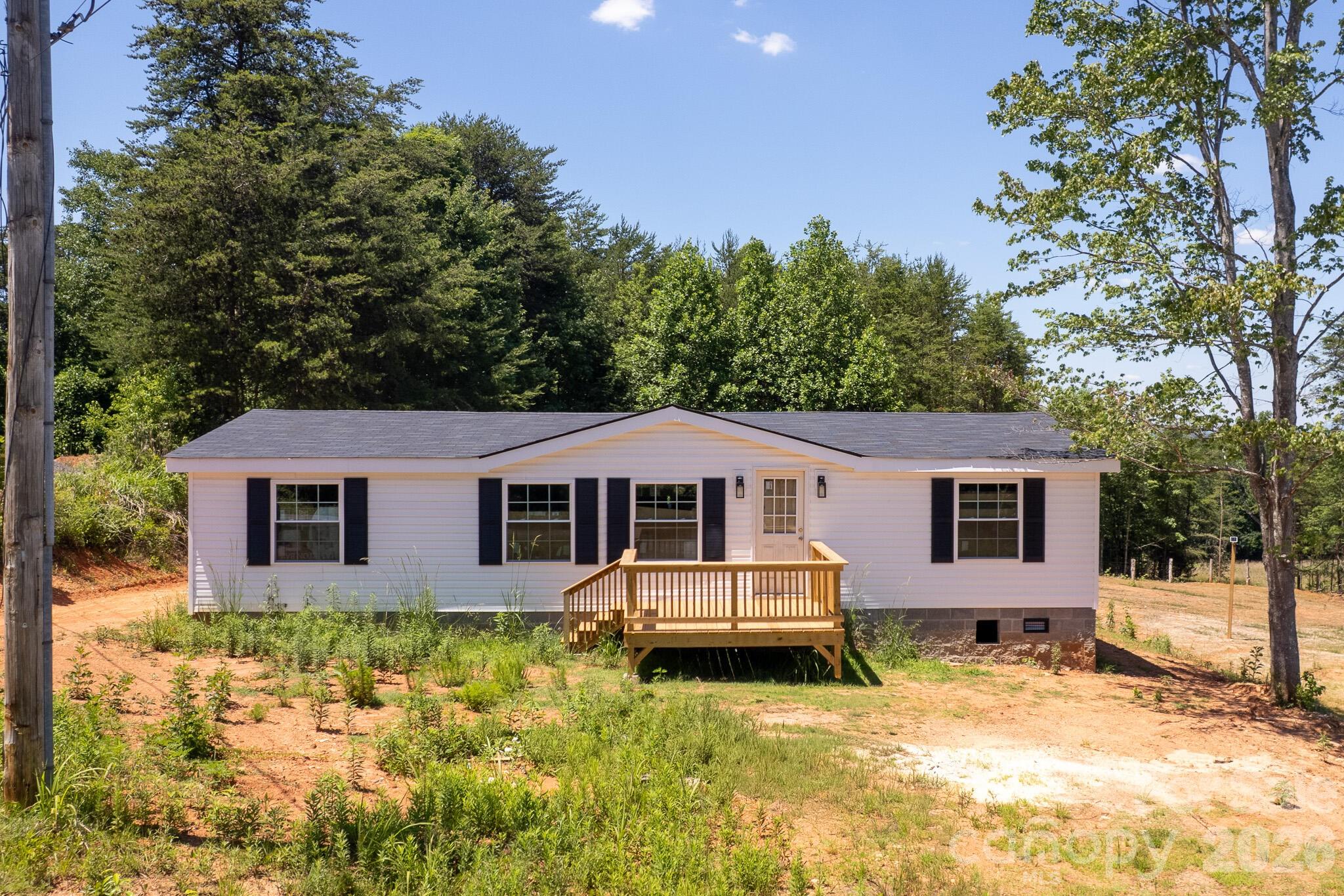 Welcome to 5358 Hope Rd in Vale, NC-a brand-new 2024 manufactured home offering modern comfort, abundant natural light, and a spacious, open layout. Never occupied, this home presents a rare opportunity to own a new construction residence at an exceptional value. Large windows fill the interior with sunlight, creating a bright and inviting atmosphere throughout. Priced to reflect a few remaining finishing touches, including landscaping, kickboard painting/sealing, and completion of sink plumbing, allowing buyers the opportunity to add their own finishing touches while building instant equity. Please note that appliances are not currently installed. Buyer to verify all information. Seller makes no representations or warranties regarding the property. Disclosures available upon request. Whether you're looking for an affordable primary residence or an investment opportunity, this move-in-ready home provides tremendous potential and value. Don't miss the chance to make it yours!
