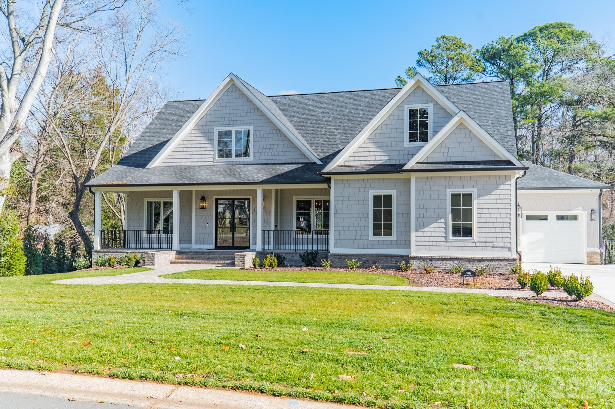 Beautiful newer construction in Providence Park on a private .6-acre lot. This charming cottage–style home offers 3 levels of living space, 6 BR/6 BA, covered front and back porches, and 2 attached garages (2- car and a separate 1-car). Flooded with natural light, the open-concept interior features high ceilings (10' on the main and lower level) and 9’ ceilings upstairs. The gourmet kitchen offers SS appliances, quartzite countertops, a large island and walk-in pantry - opening seamlessly to the vaulted great room which flows into the dining area, and outdoor living space. The main-level primary suite is a true retreat, with luxury en suite bathroom featuring a soaking tub, separate shower, dual vanities, and walk-in closet. Upstairs features 2 bedrooms, a full bath, a bonus room, and a second laundry room. The lower level suite is thoughtfully designed for entertaining, wellness days or extended stays, featuring a family room with fireplace, kitchenette, wine cellar, exercise room, and a private spa experience with sauna and oversized walk-in shower,. Two additional bedrooms and ample storage complete this level. Outdoors, the fenced and landscaped backyard provides privacy and tranquility, enhanced with full irrigation and a whole-house generator - an exceptional finishing touch to this quiet setting convenient to Cotswold, Uptown and SouthPark.